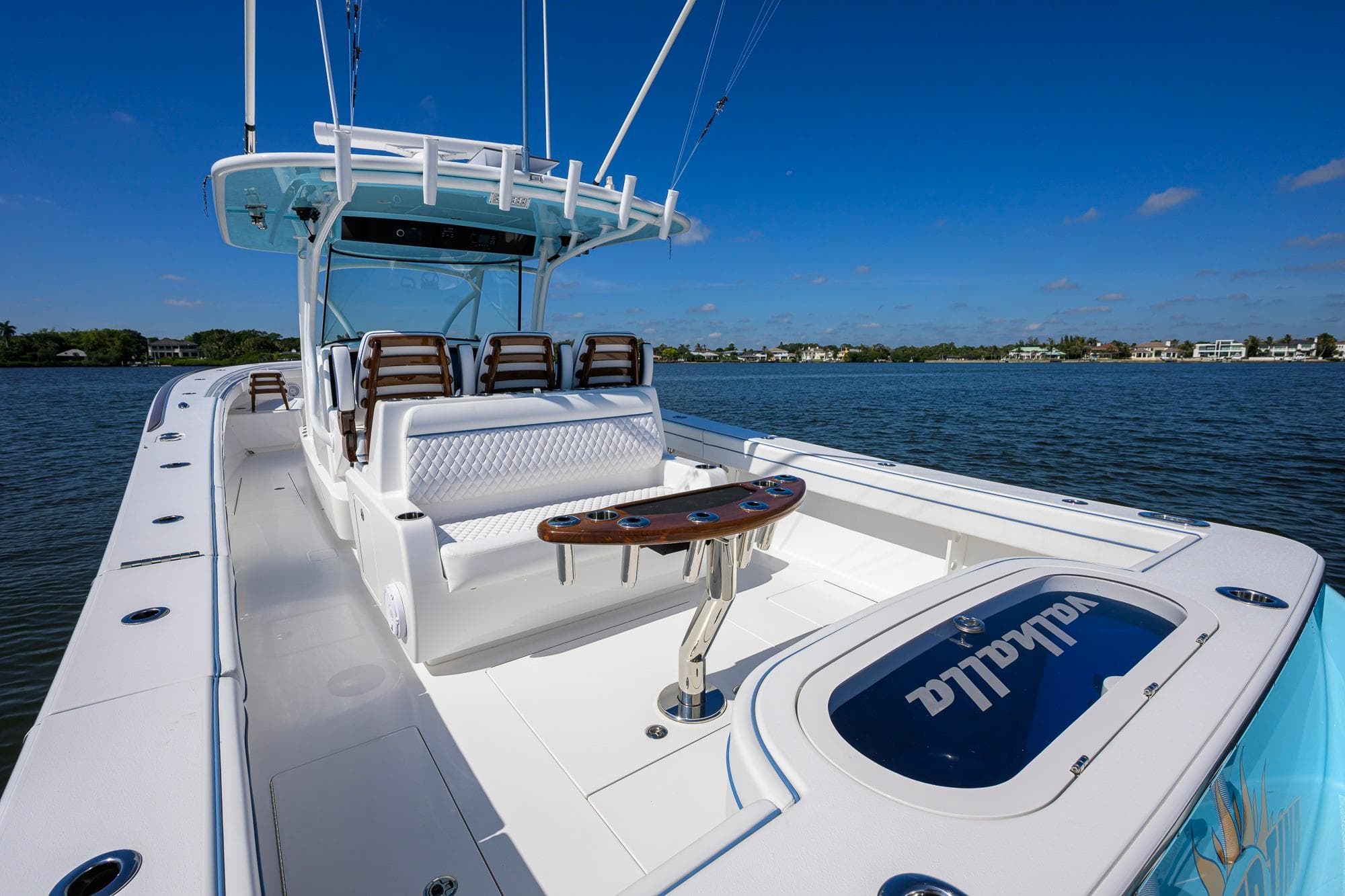 2025 Valhalla Boatworks V-41 on water, showcasing sleek design and spacious seating.