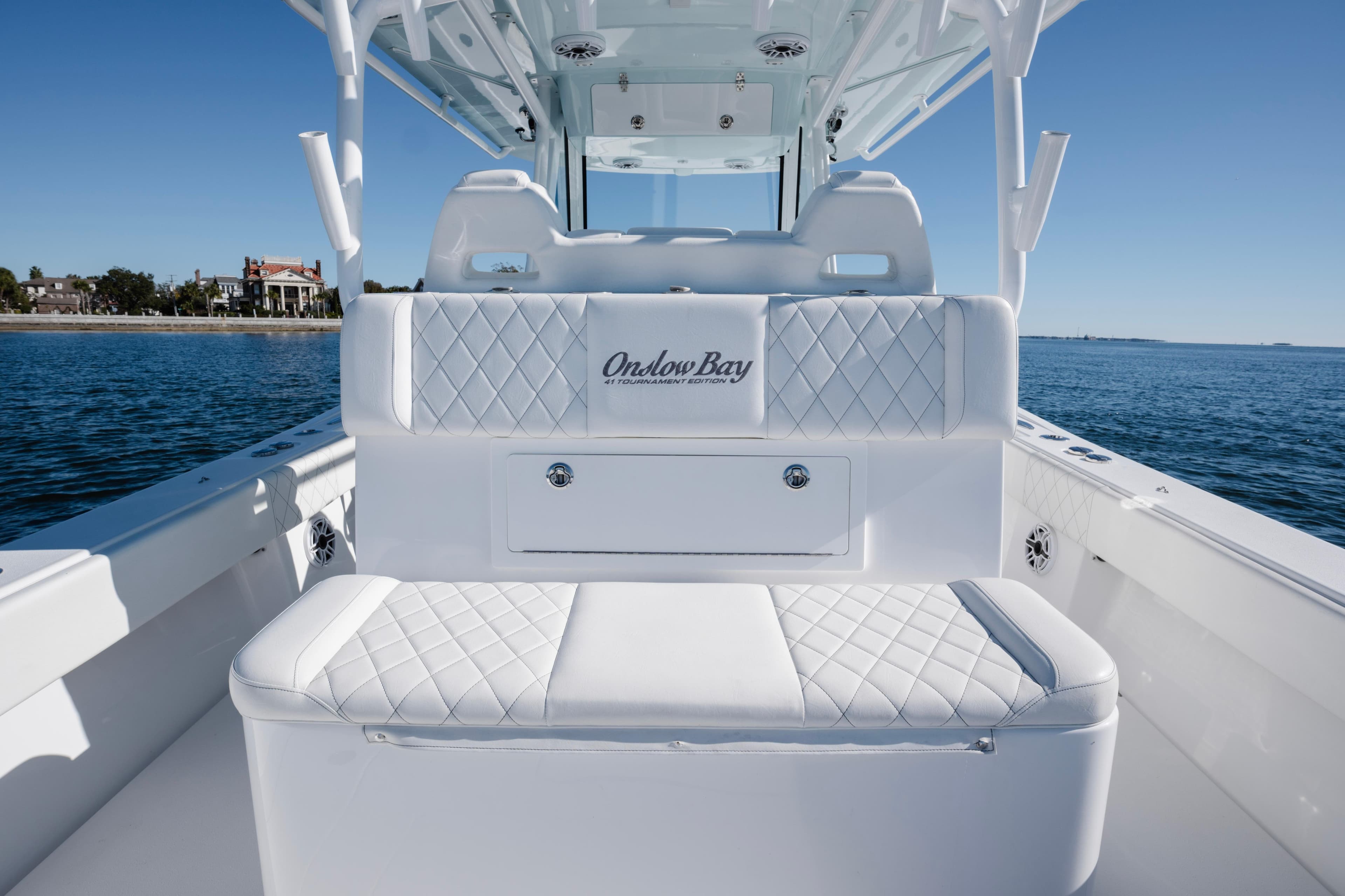 2021 Onslow Bay 41 Tournament Edition boat interior with white seating on calm water.
