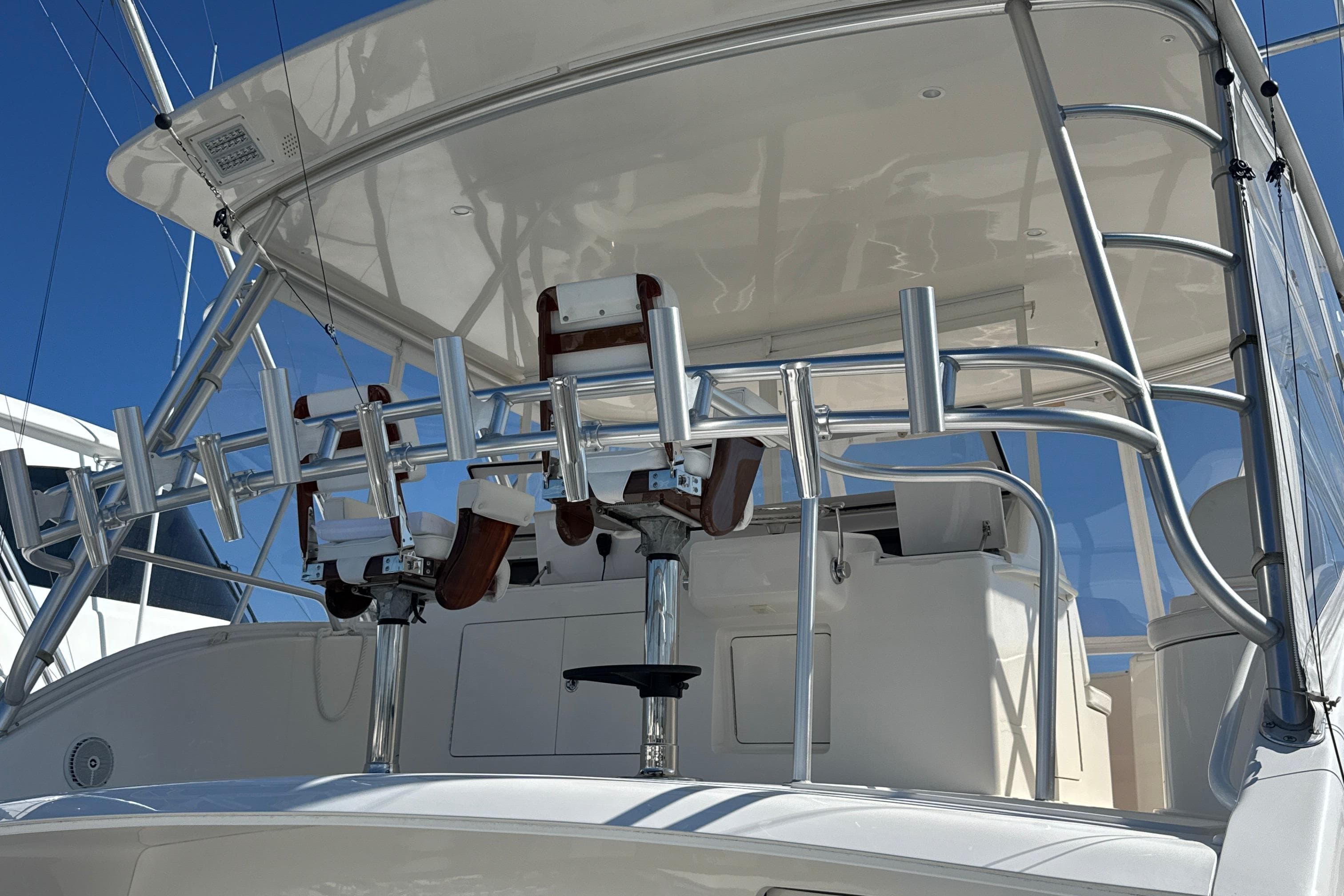2006 Viking 56 Convertible yacht with fishing rod holders and helm station.