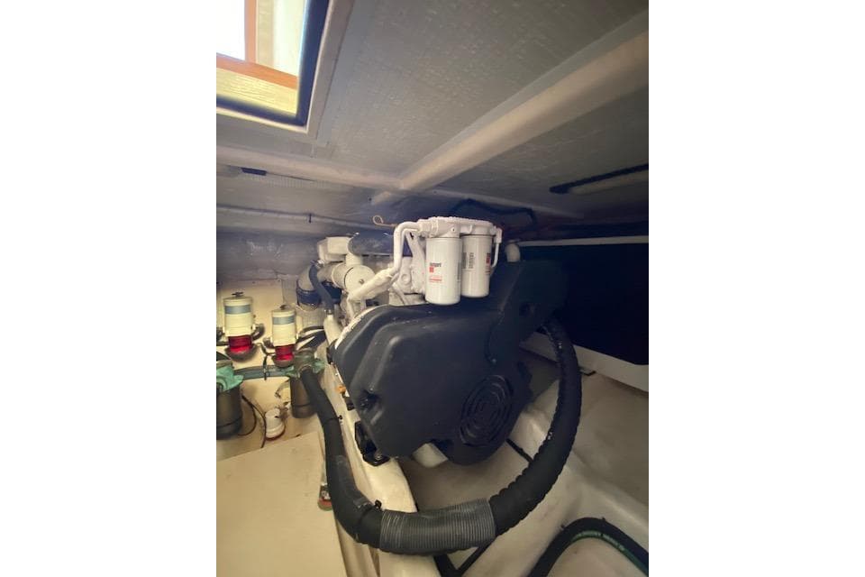Engine room of a 2010 Sabre 40 Sedan yacht, showcasing mechanical components.