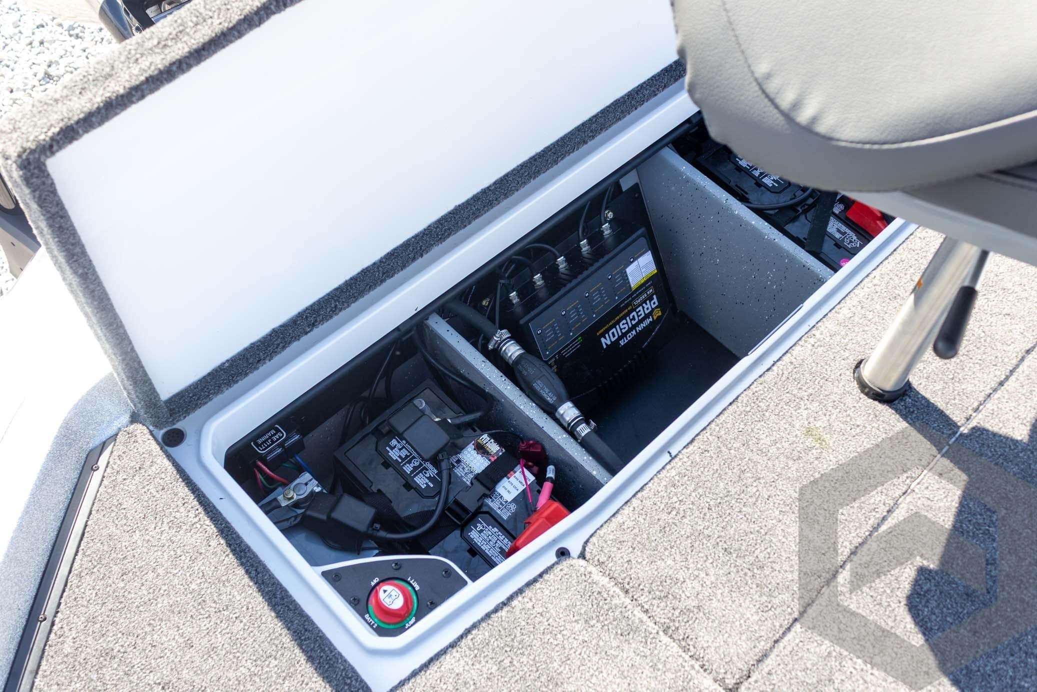 2026 Vexus VXs20 boat battery compartment with precision charger and wiring.