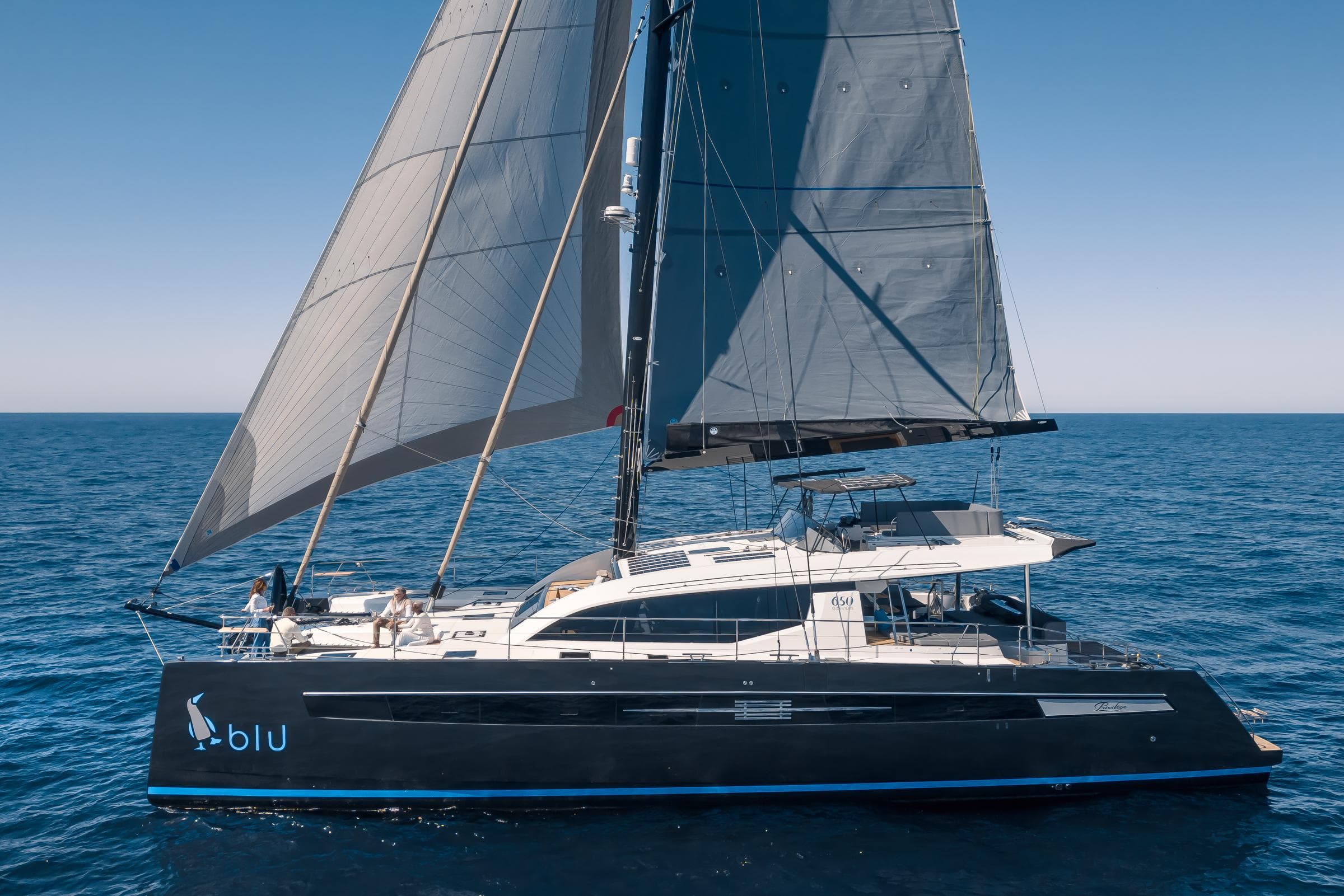 2025 Privilege Signature 650 yacht sailing on open sea under clear blue sky.