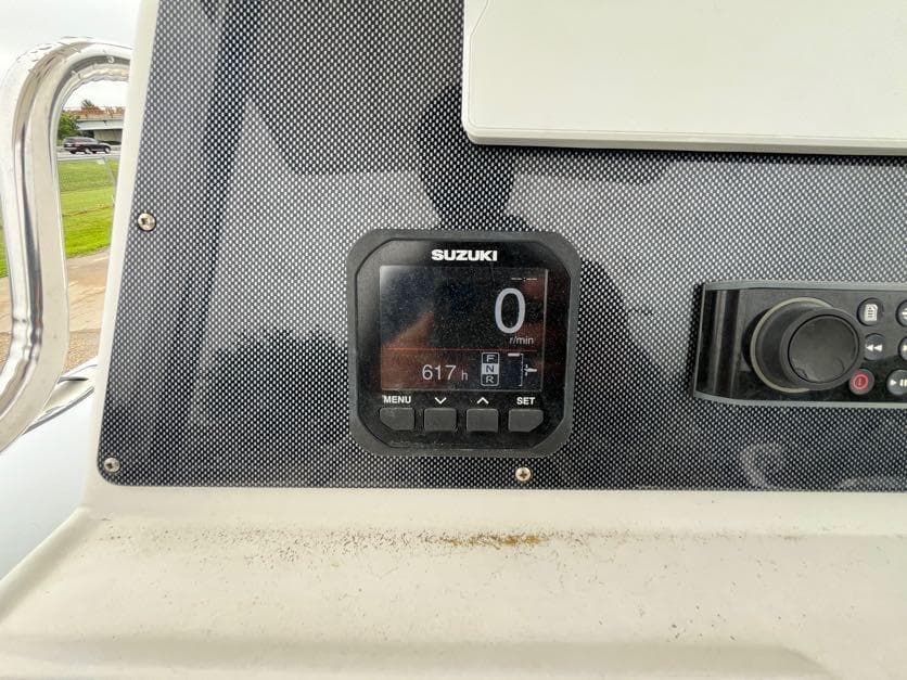 Dashboard of a 2019 Apex A-24 boat featuring a Suzuki digital display.