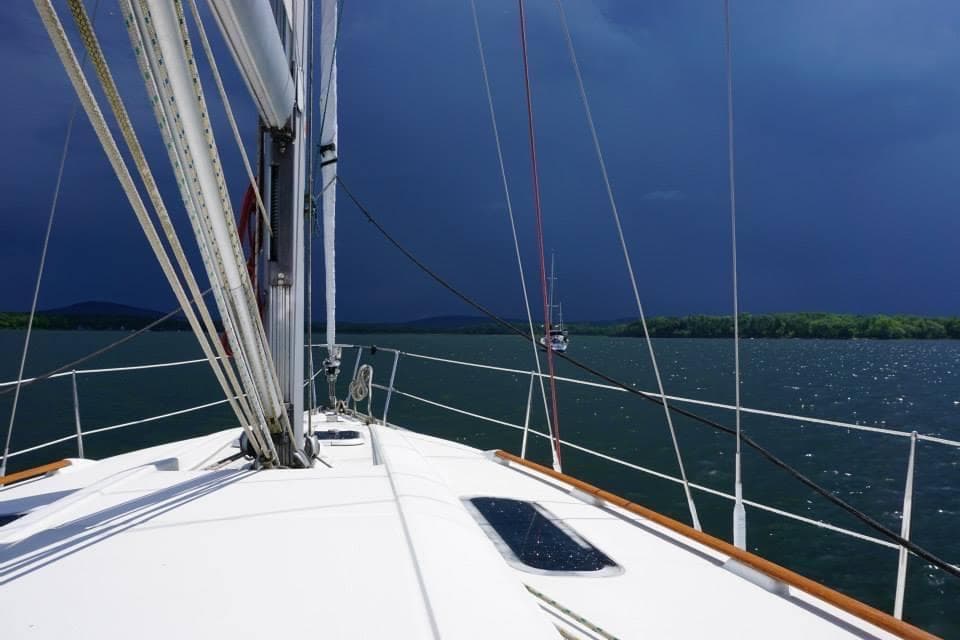 1999 Beneteau Oceanis 352 sailboat on stormy waters.