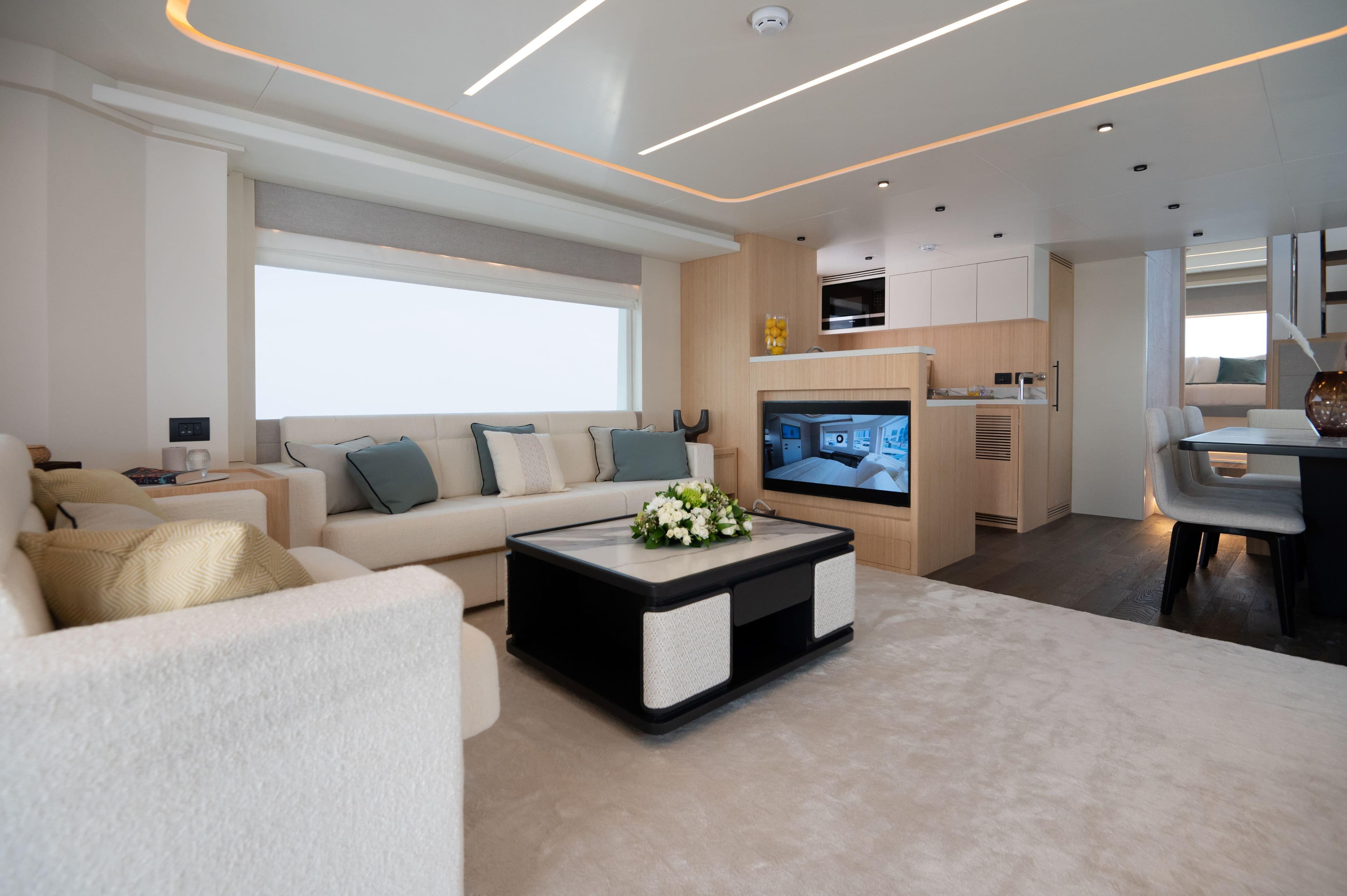 Luxurious interior of 2025 Nomad 70 SUV yacht with modern furnishings and elegant design.