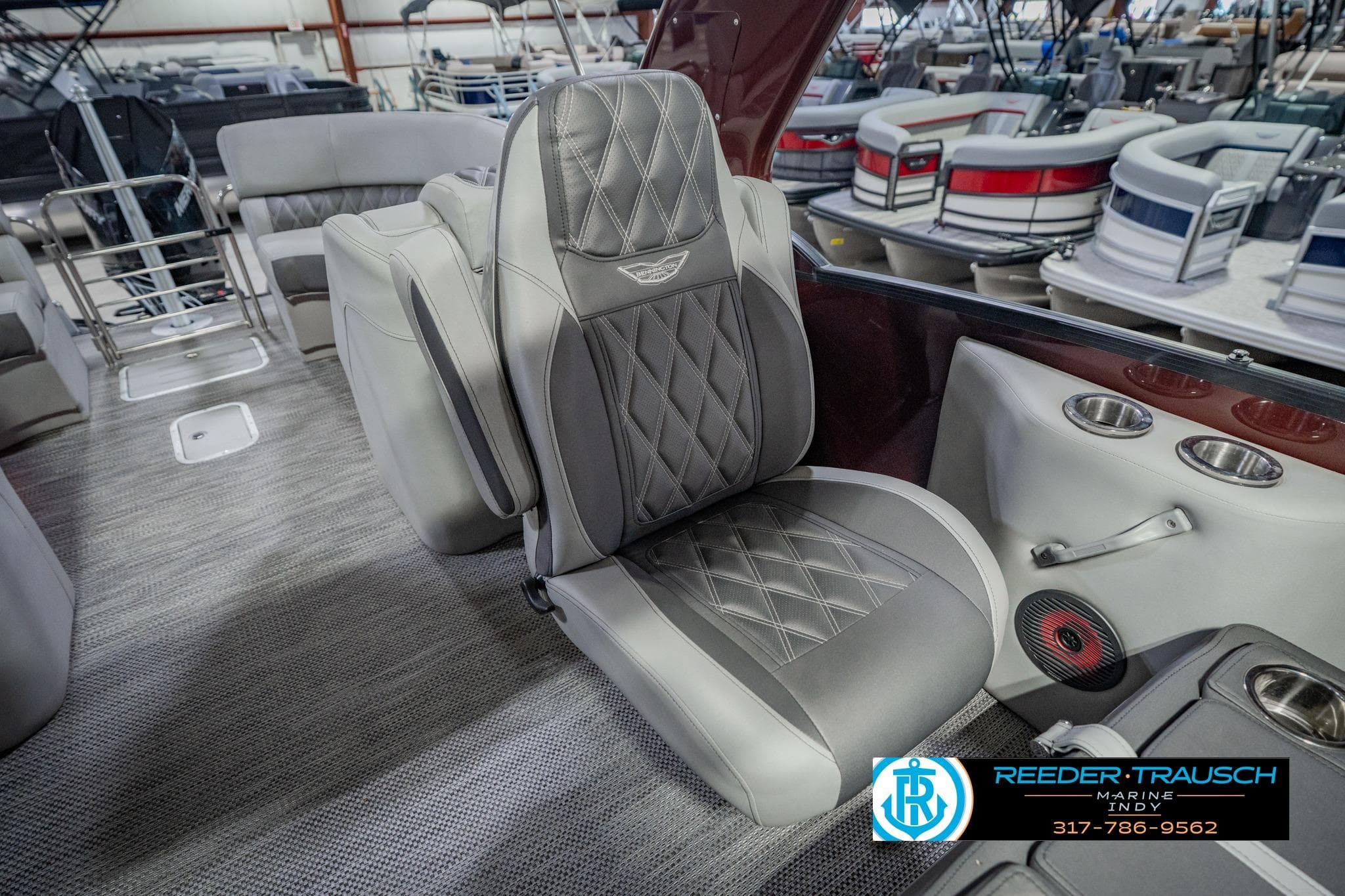 Luxurious seating on a 2022 Bennington 23 QXFBA pontoon boat, featuring diamond-stitched upholstery.