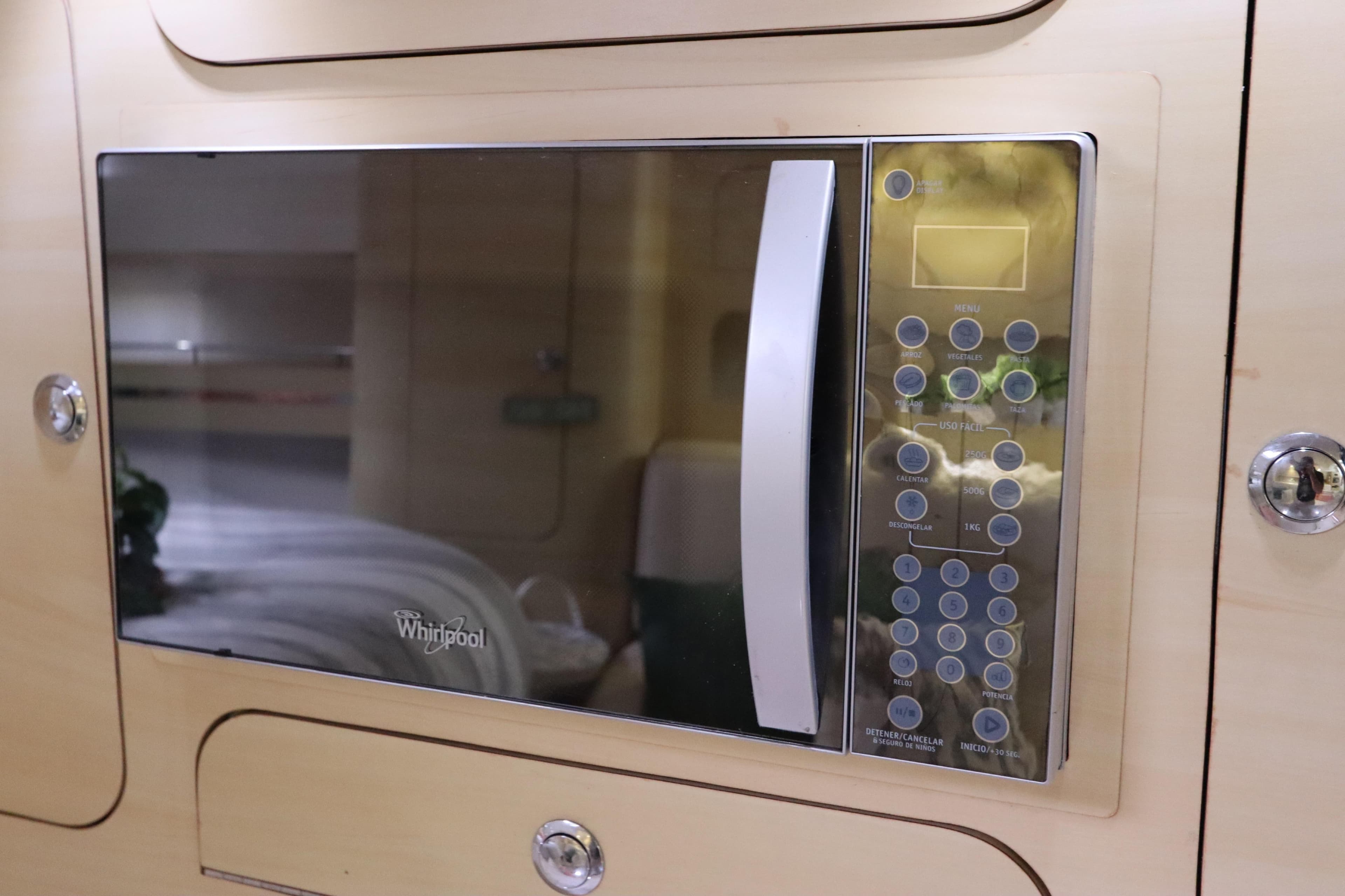 Built-in Whirlpool microwave in 2014 Intermarine 380 Sport yacht interior.
