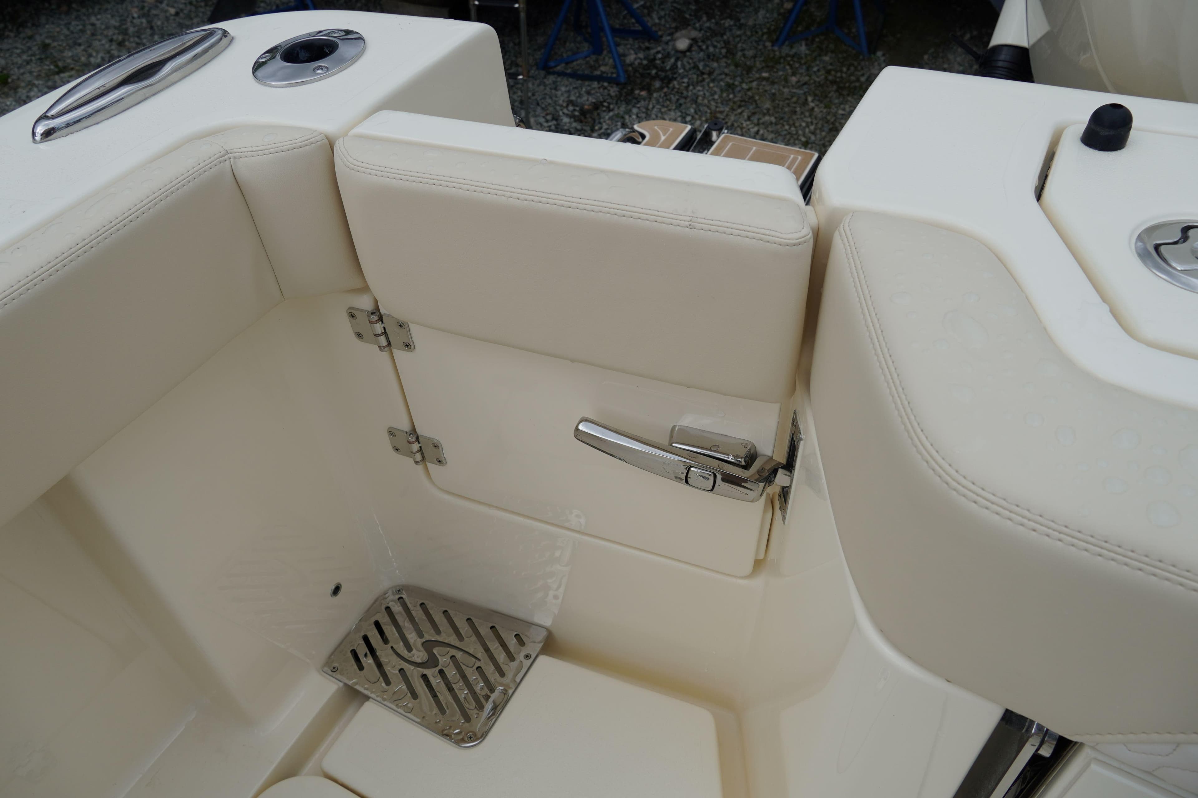 2026 Scout 288 LXF boat interior with beige seating and stainless steel hardware.