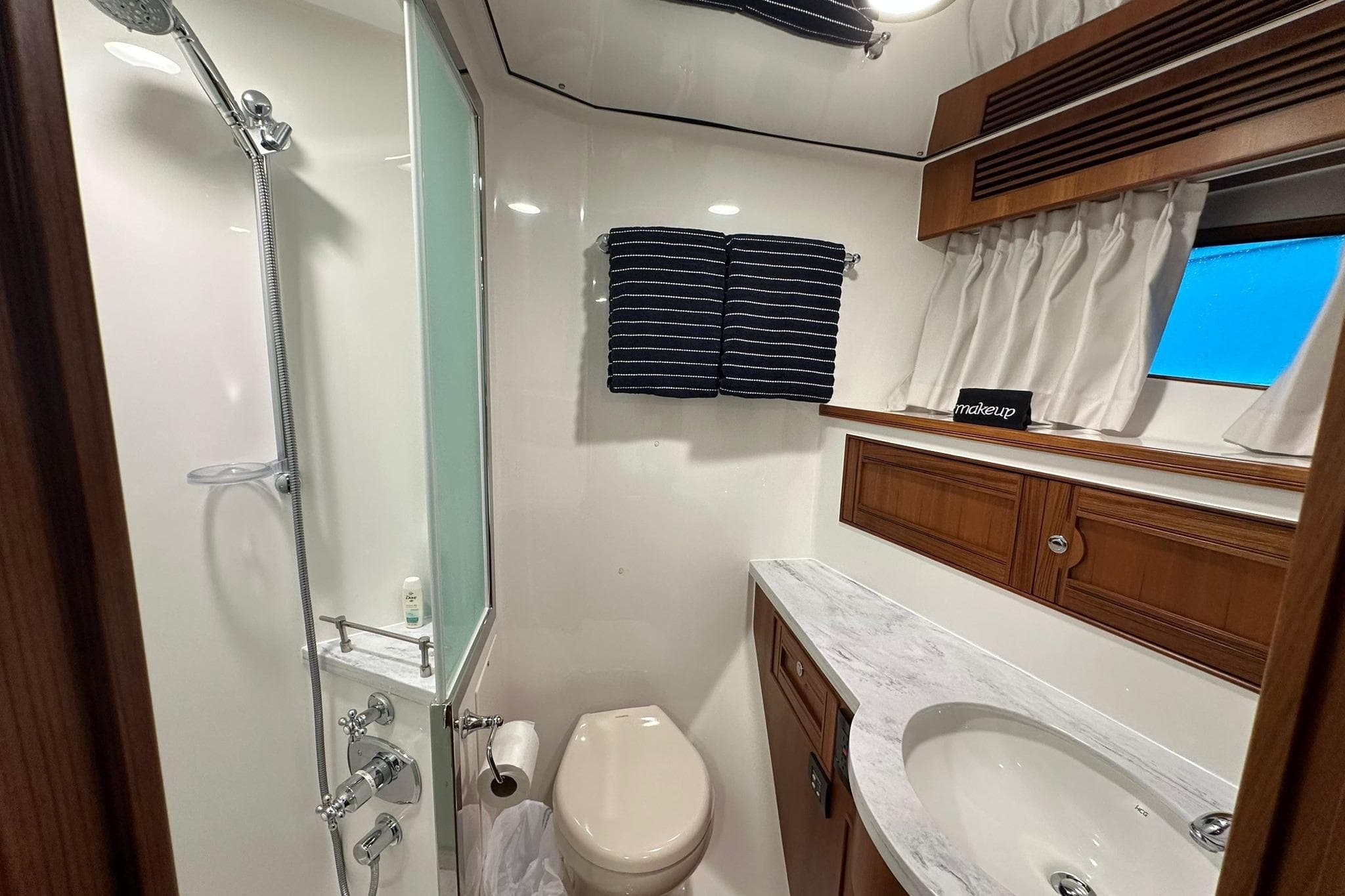 Luxurious bathroom in 2023 Marlow Explorer 66E-CB yacht with modern fixtures and elegant design.