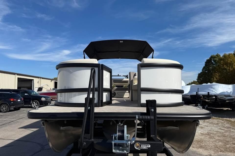2026 Alera M 25Q pontoon boat on trailer under clear blue sky.