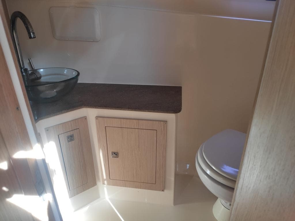 Interior of Nuova Jolly Prince 38, bathroom with sink and toilet.