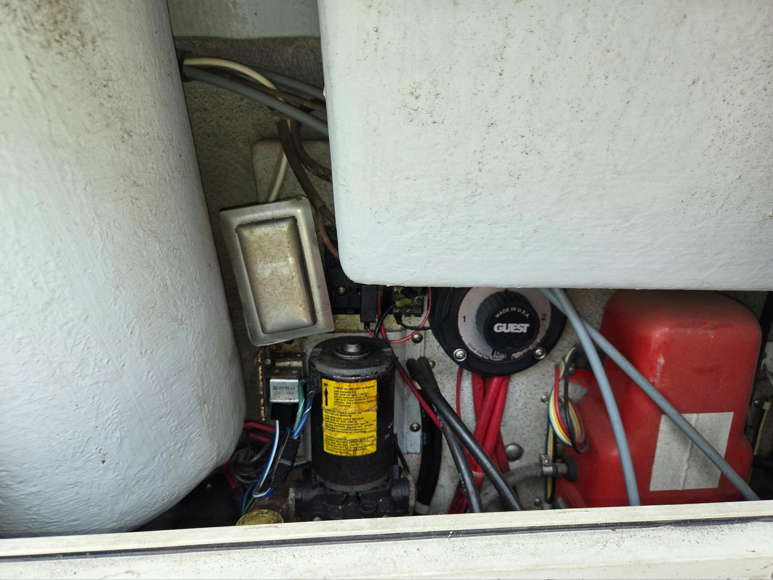 Engine compartment of a 1995 SeaSport 2400 Explorer boat, showing various mechanical components.