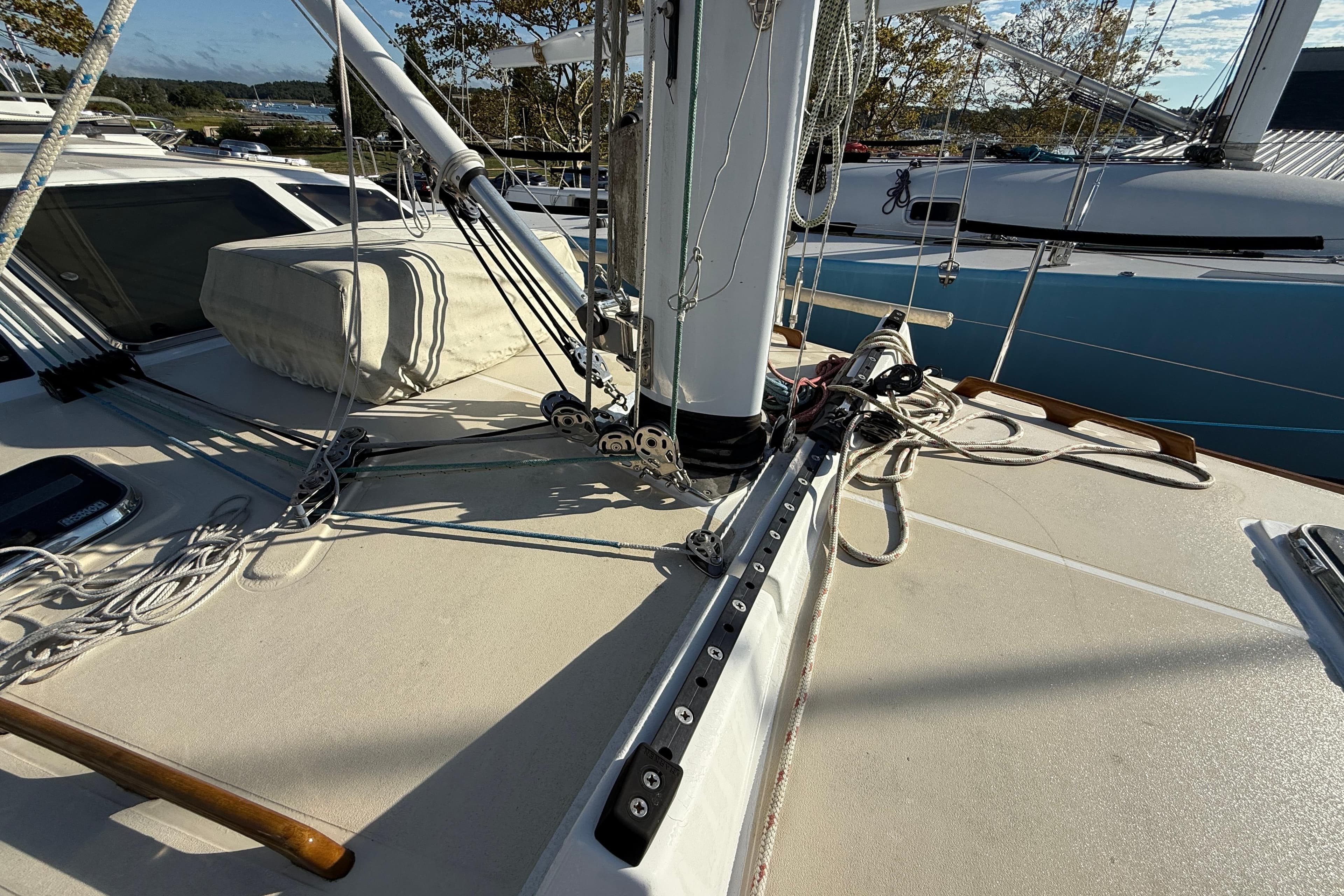 Deck of 2011 Tartan 4700 sailboat with rigging and ropes.