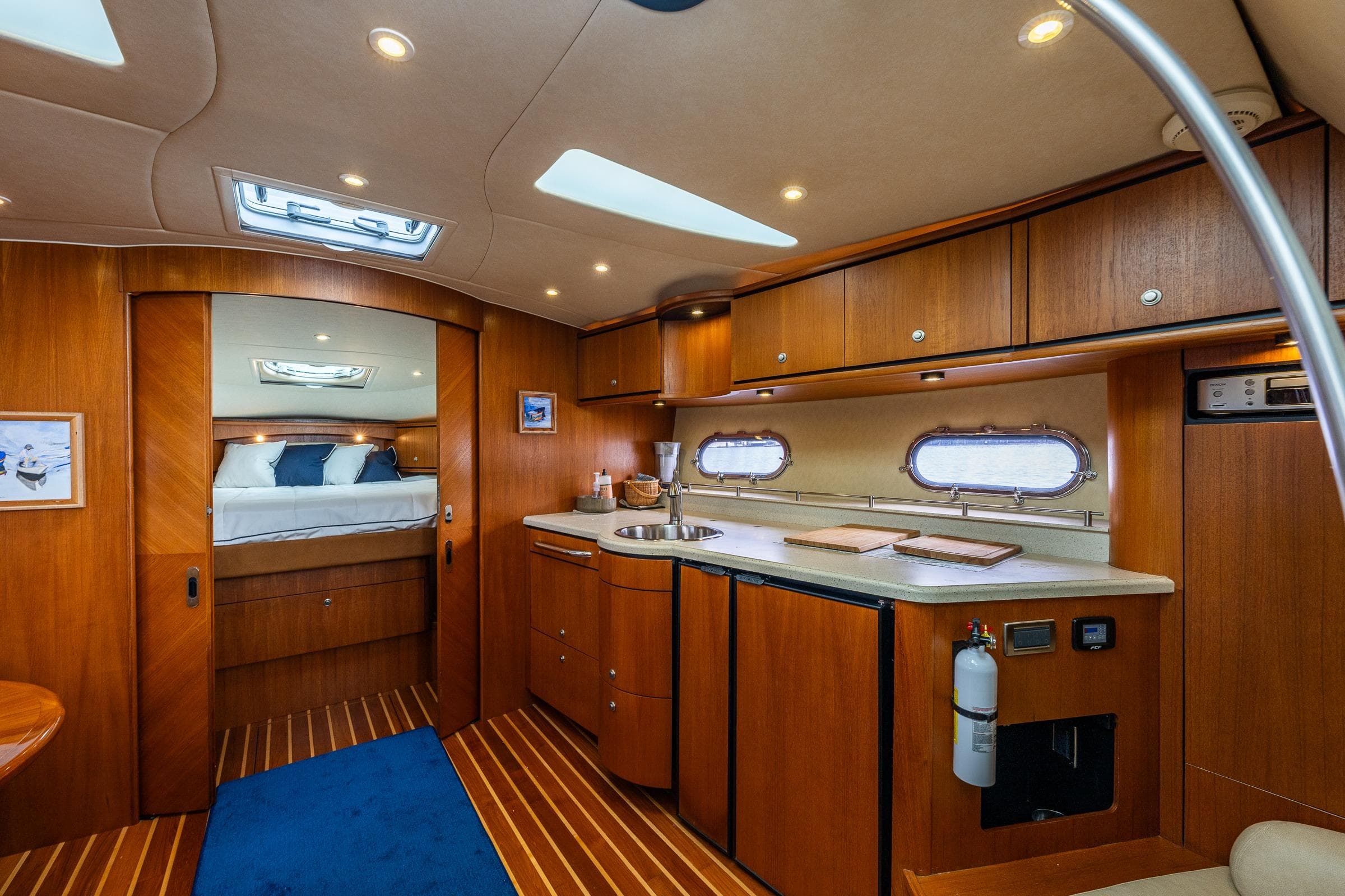 Luxurious interior of 2007 Tiara Yachts 3900 Sovran with wood cabinetry and modern amenities.