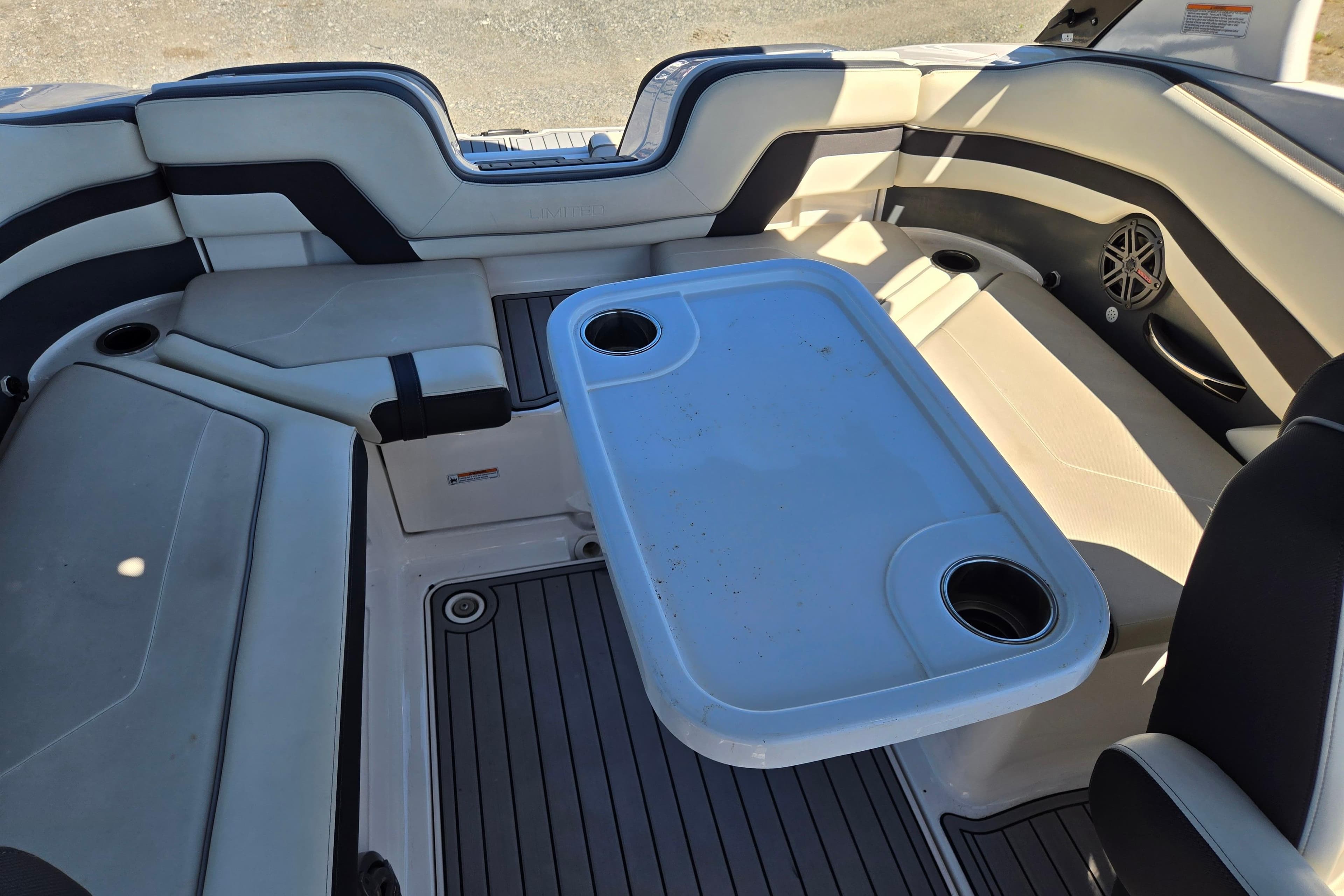 2016 Yamaha Boats 242 Limited S E-Series interior with seating and table setup.