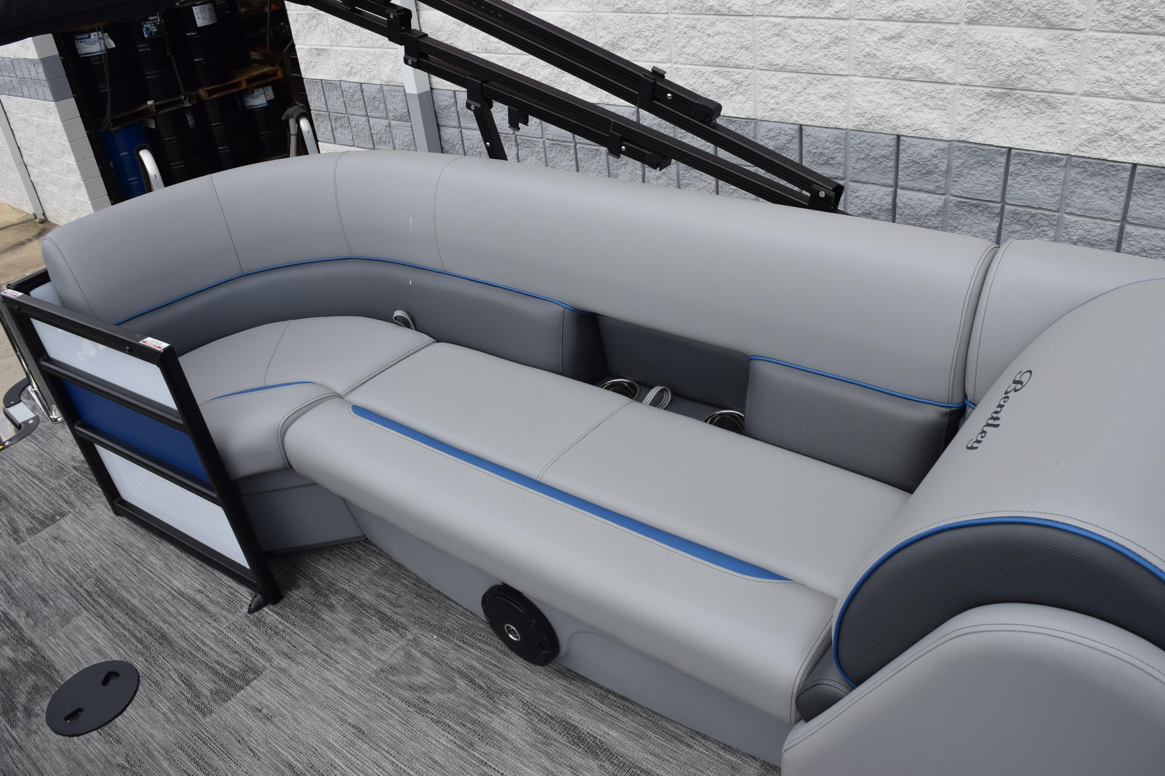 2026 Bentley Pontoons Bolt 223 interior with gray seating and blue accents.
