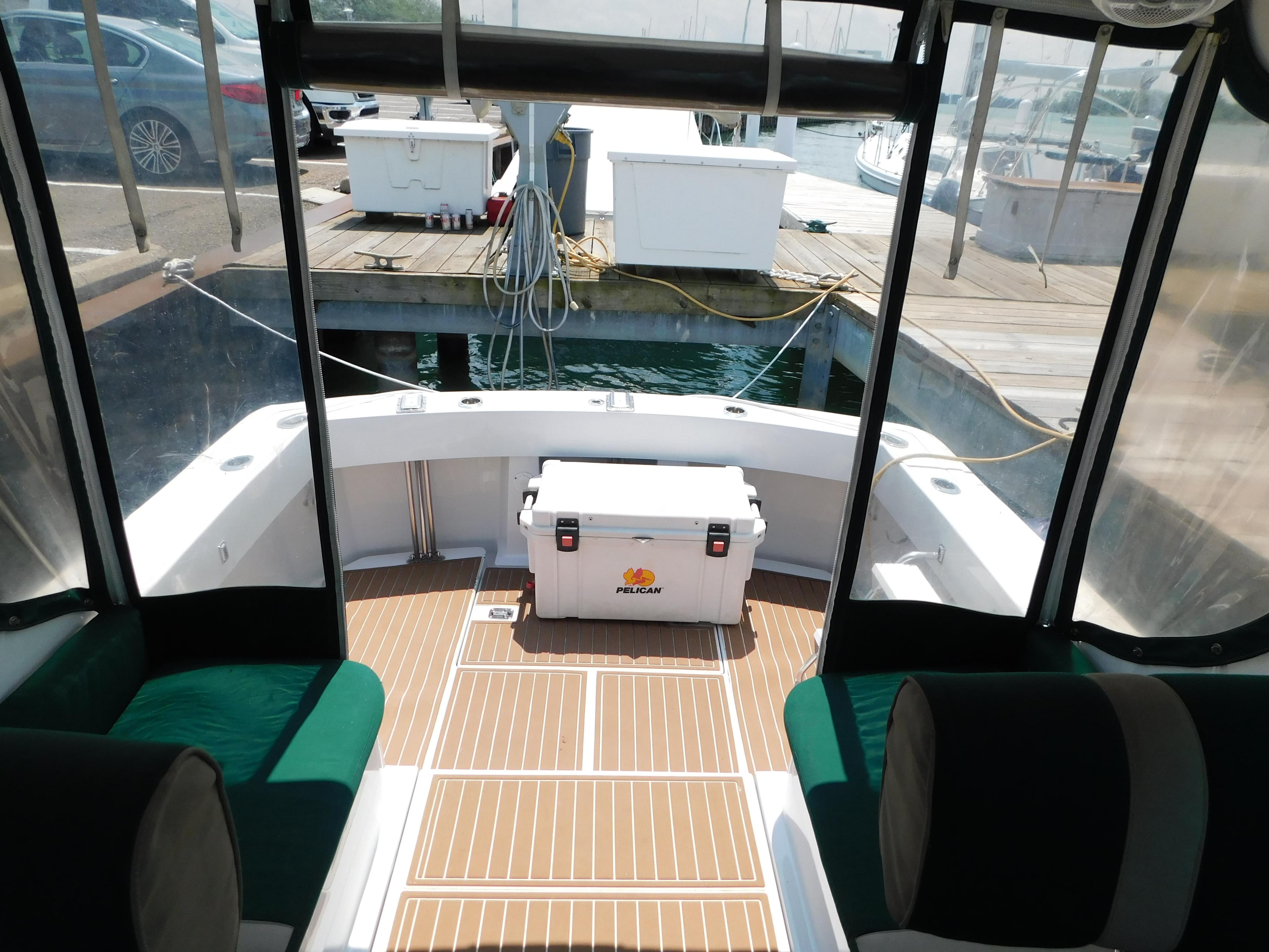 1999 Mainship Pilot 30 boat interior with Pelican cooler on deck.