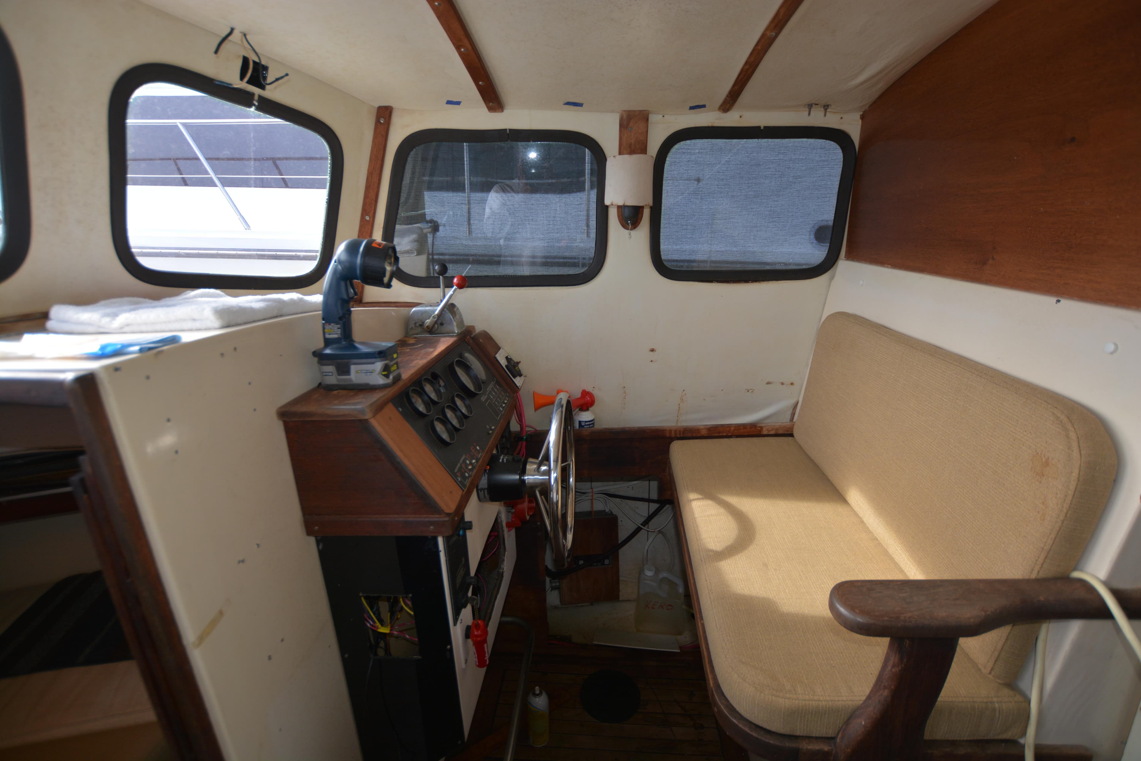 1974 Fales Navigator boat interior with steering wheel and control panel.
