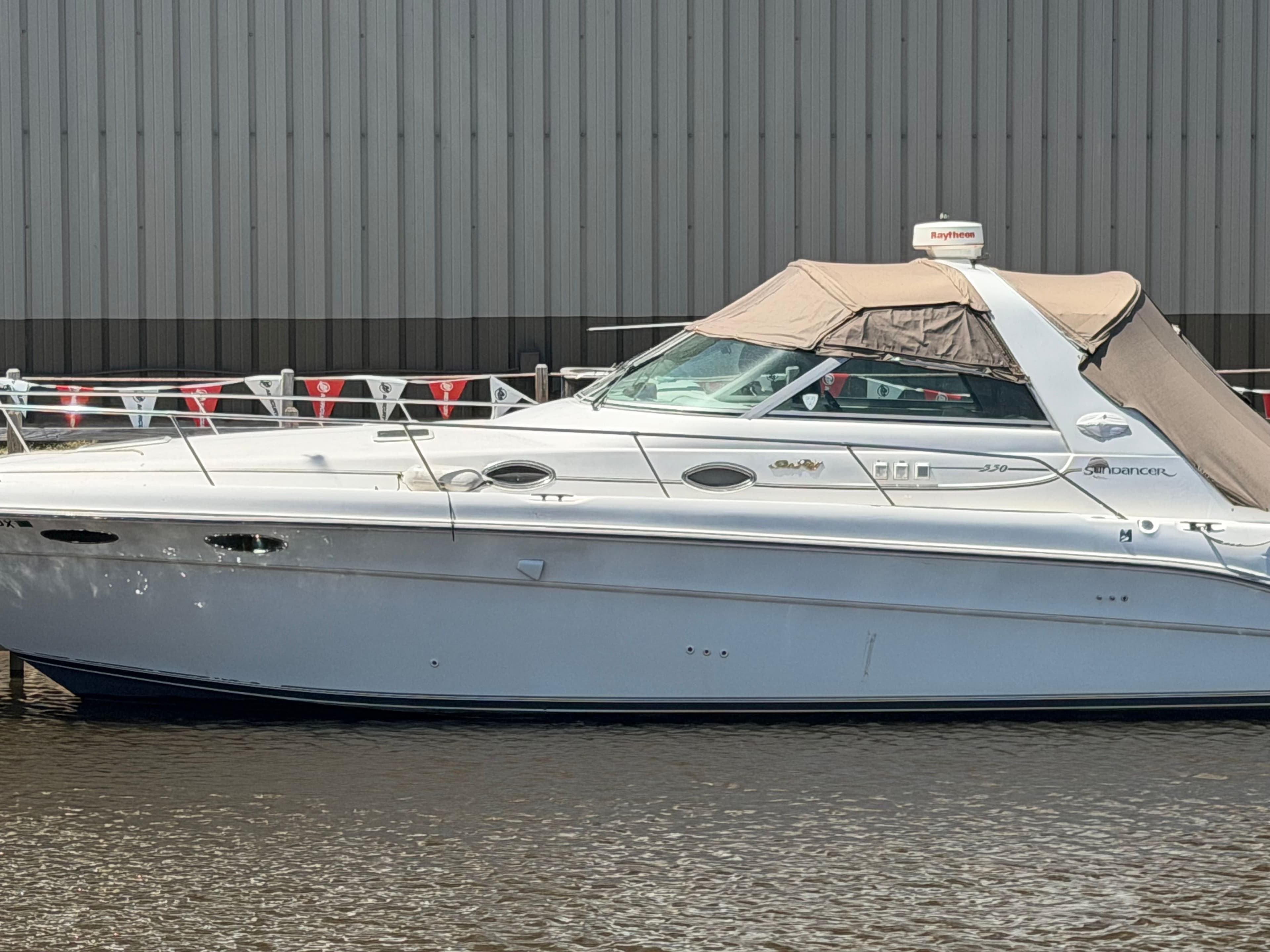 1996 Sea Ray Sundancer 330 yacht docked at harbor.