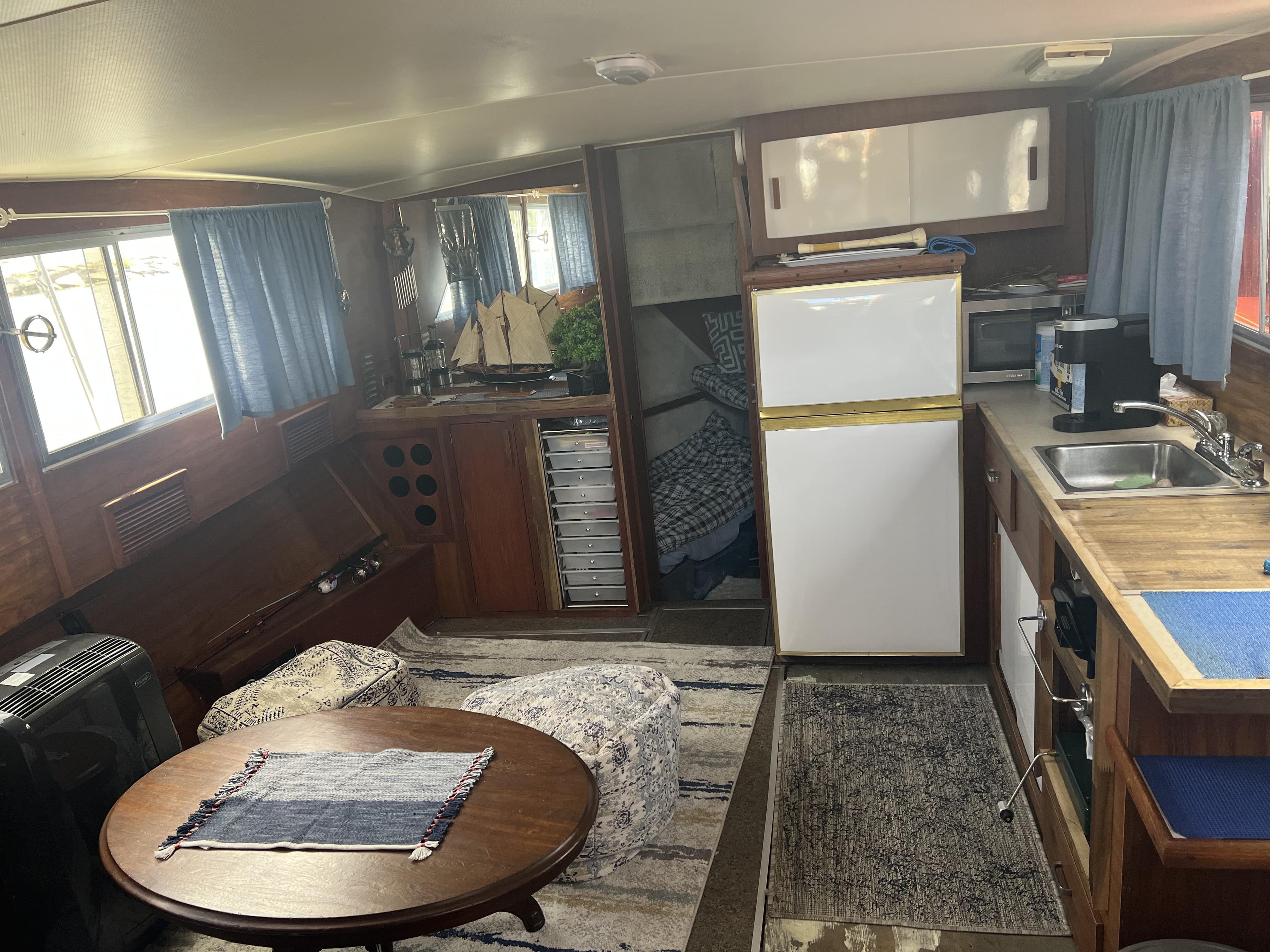 Interior of 1979 Chris-Craft 350 Catalina boat with kitchen and seating area.