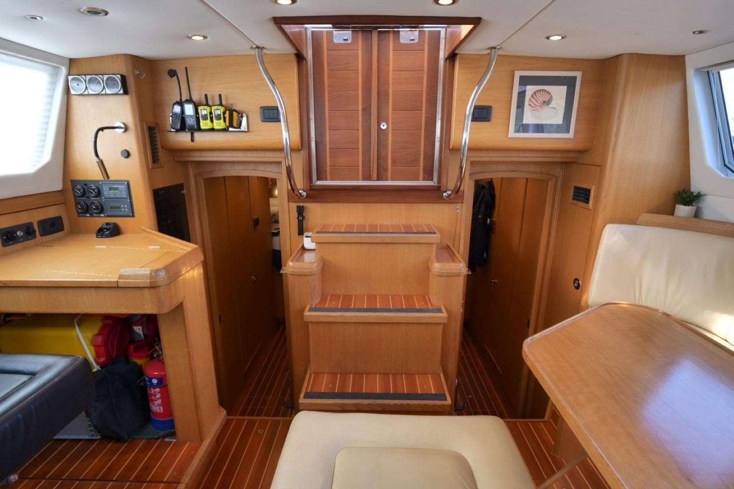 Luxurious interior of a 2016 Bruce Roberts 16.5m Expedition Yacht with wooden finishes.