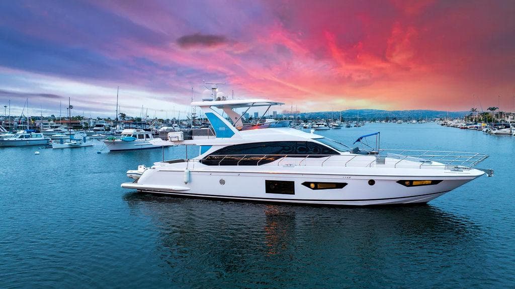 Luxury Azimut 66 yacht on water at sunset, 2020 model.