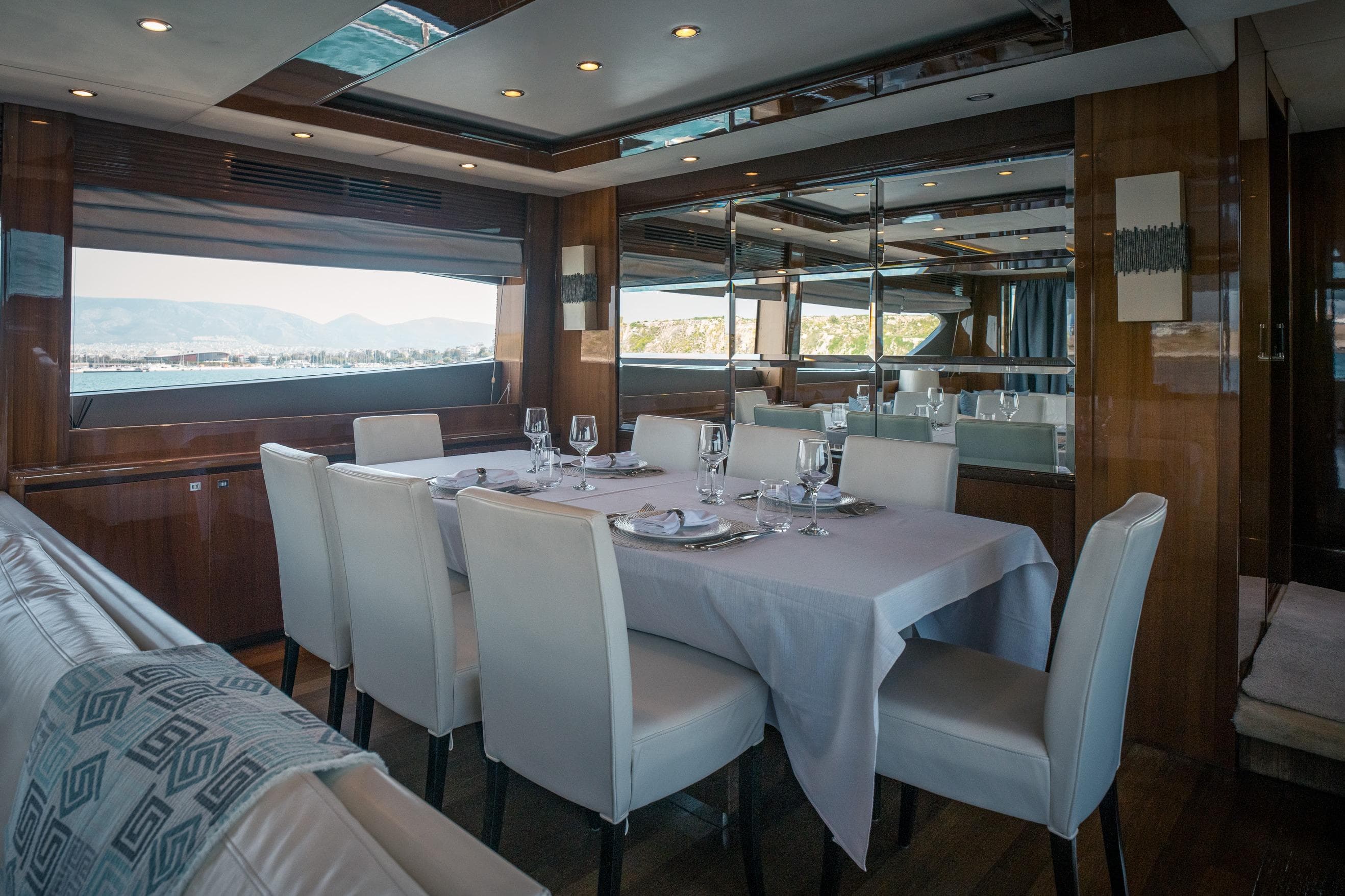 Luxurious dining area on a 2012 Princess 85 Motor Yacht with elegant table setting.