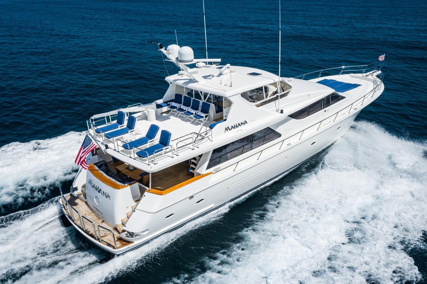 2001 West Bay SonShip Pilothouse yacht cruising on open water, featuring spacious deck and sleek design.