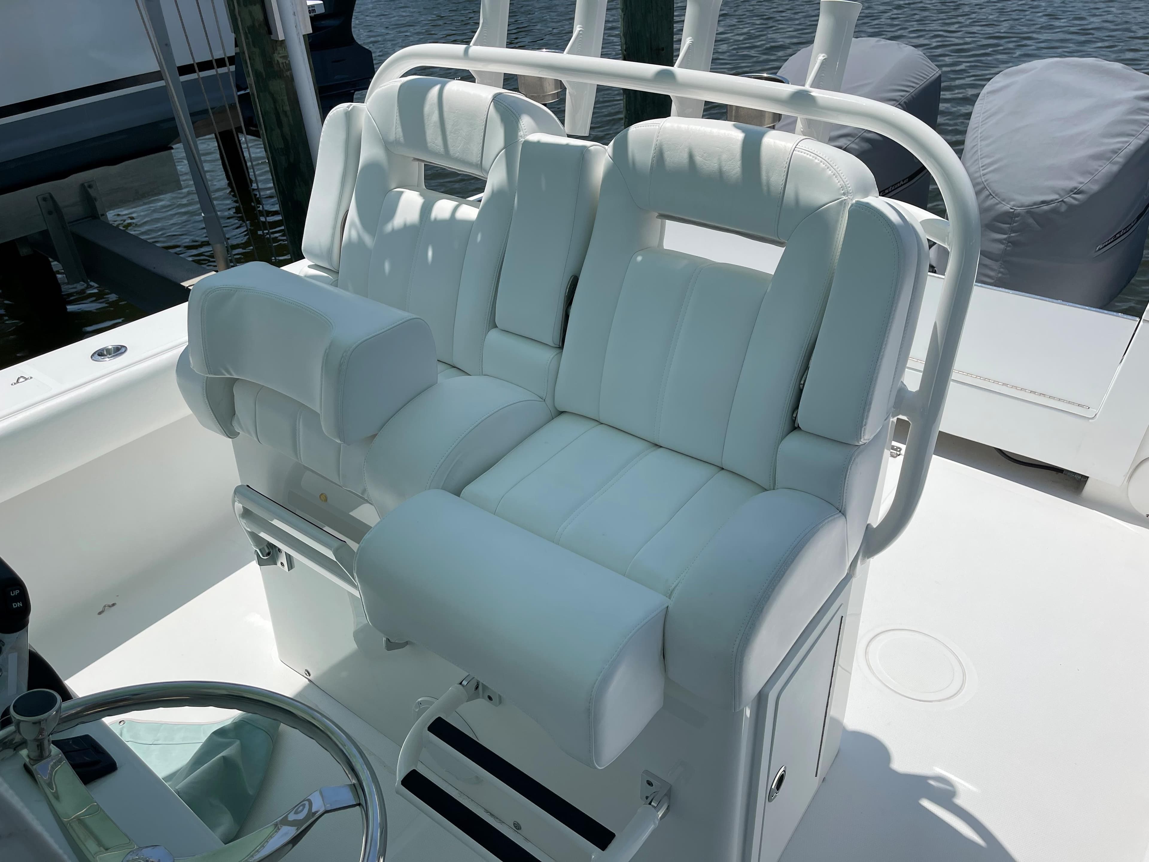 Luxurious white seating on 2007 SeaCraft 32 boat.