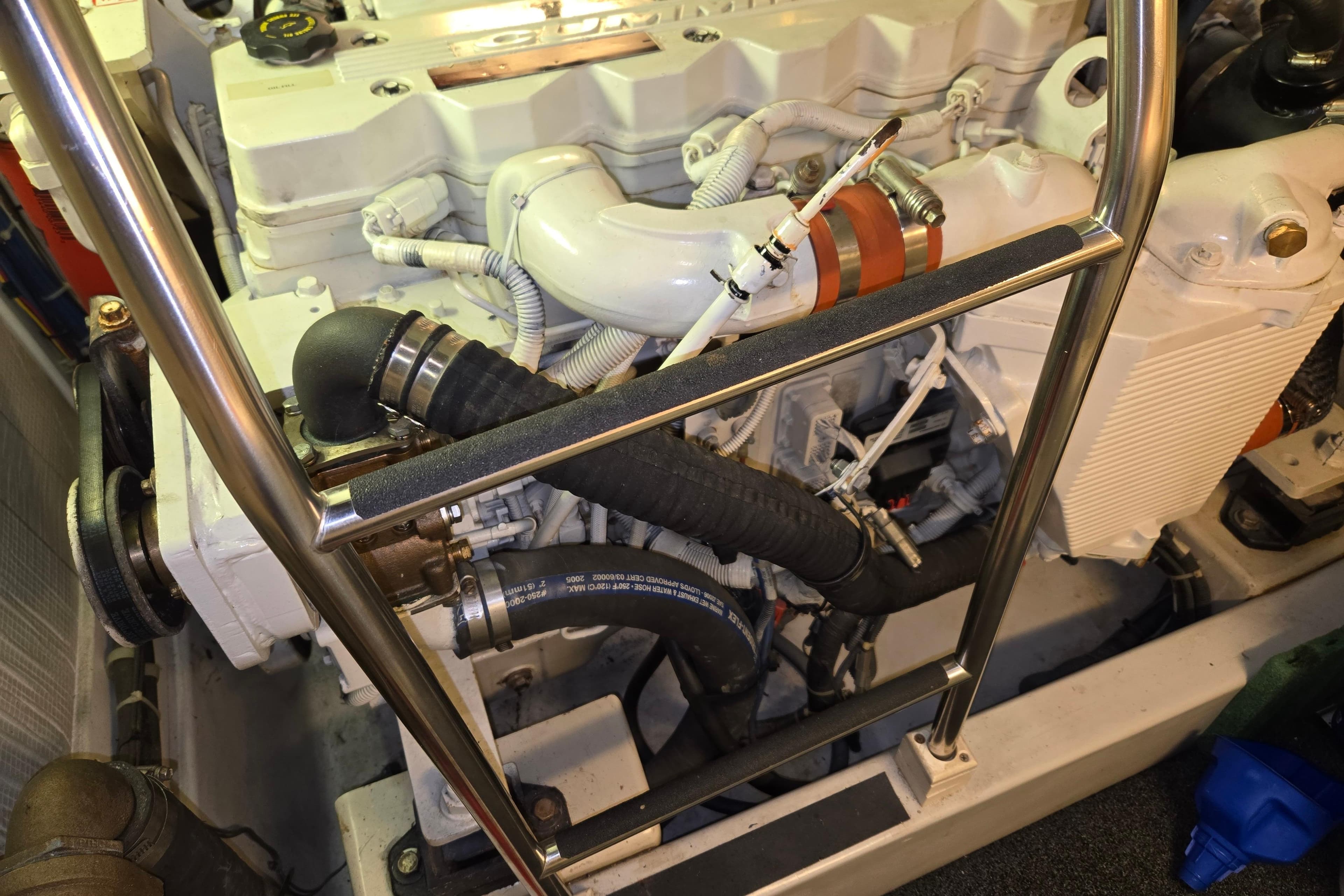 Engine room of 2006 American Tug 34 Pilothouse Trawler, showcasing detailed mechanical components.