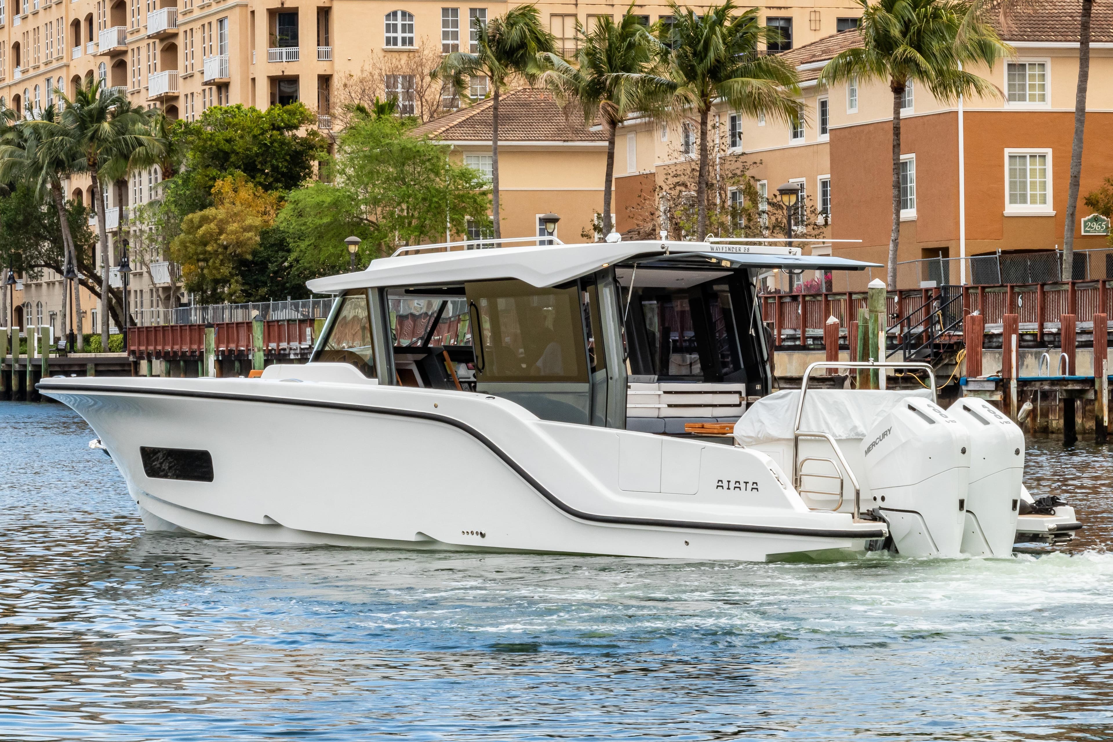 Aiata Wayfinder 38 Cabin 2026 on water near buildings.