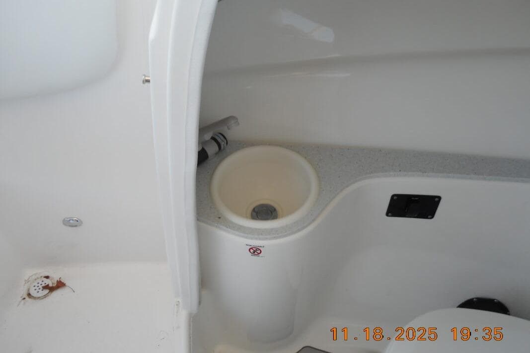 Interior view of 2026 Sea Fox 228 Traveler boat, featuring a compact sink area.