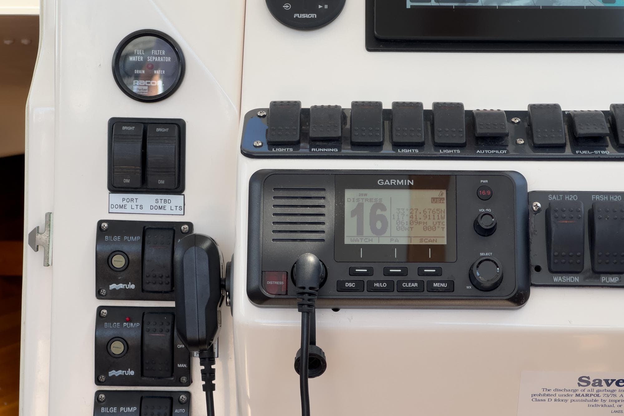 Control panel of a 2007 True North 38 boat featuring Garmin navigation system and switches.
