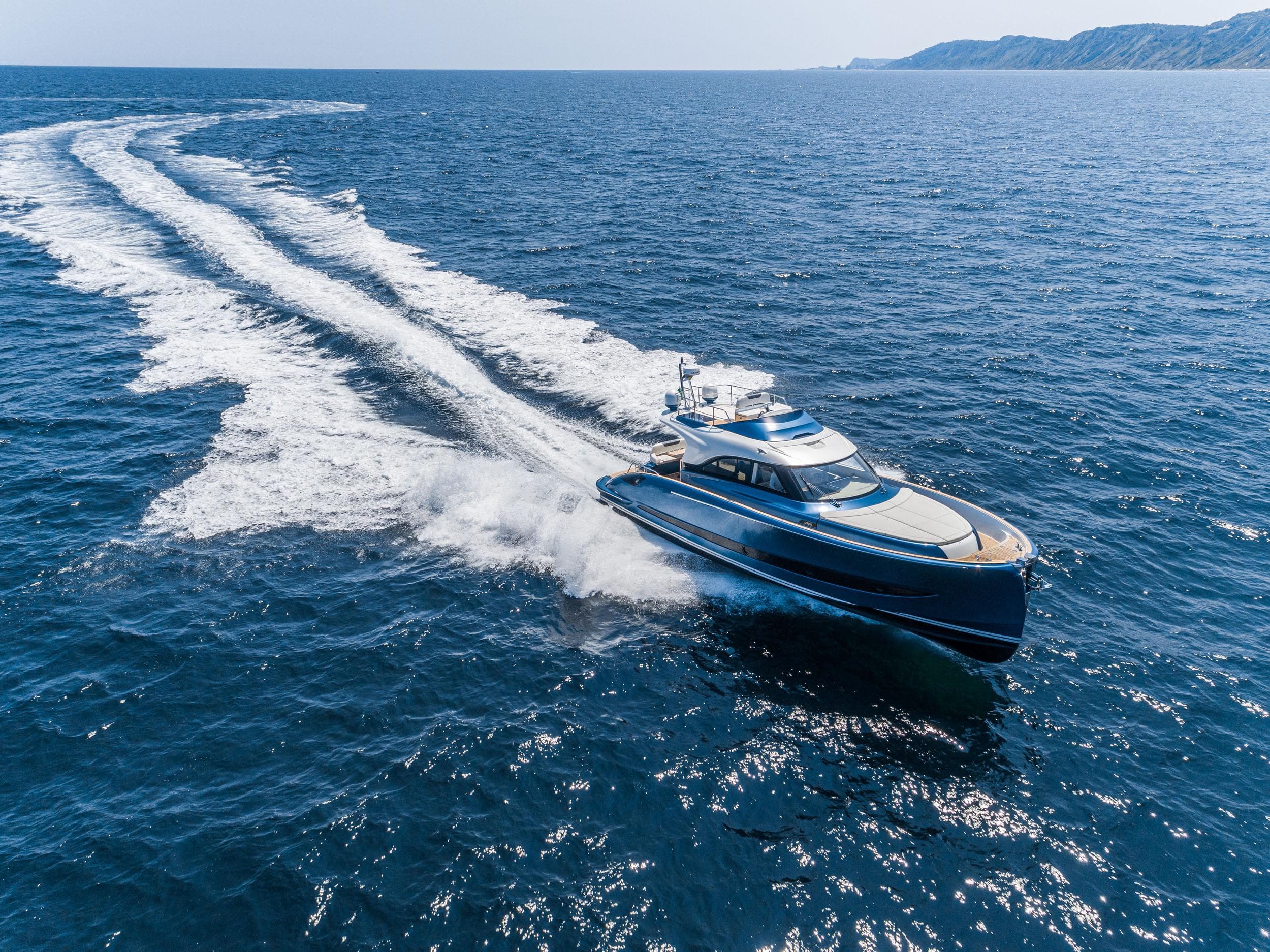2024 Solaris Power 48 Flybridge yacht cruising on open sea.