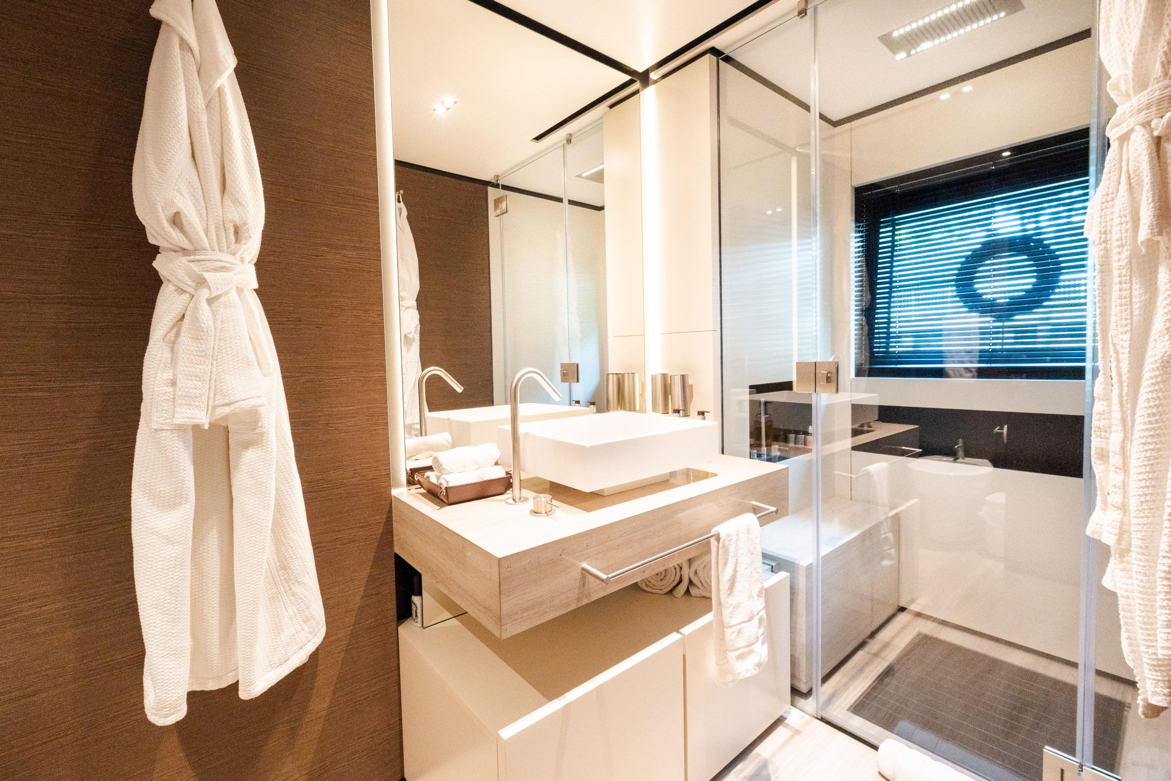 Luxurious bathroom in 2018 Custom Line Navetta 33 yacht, featuring modern fixtures and elegant design.