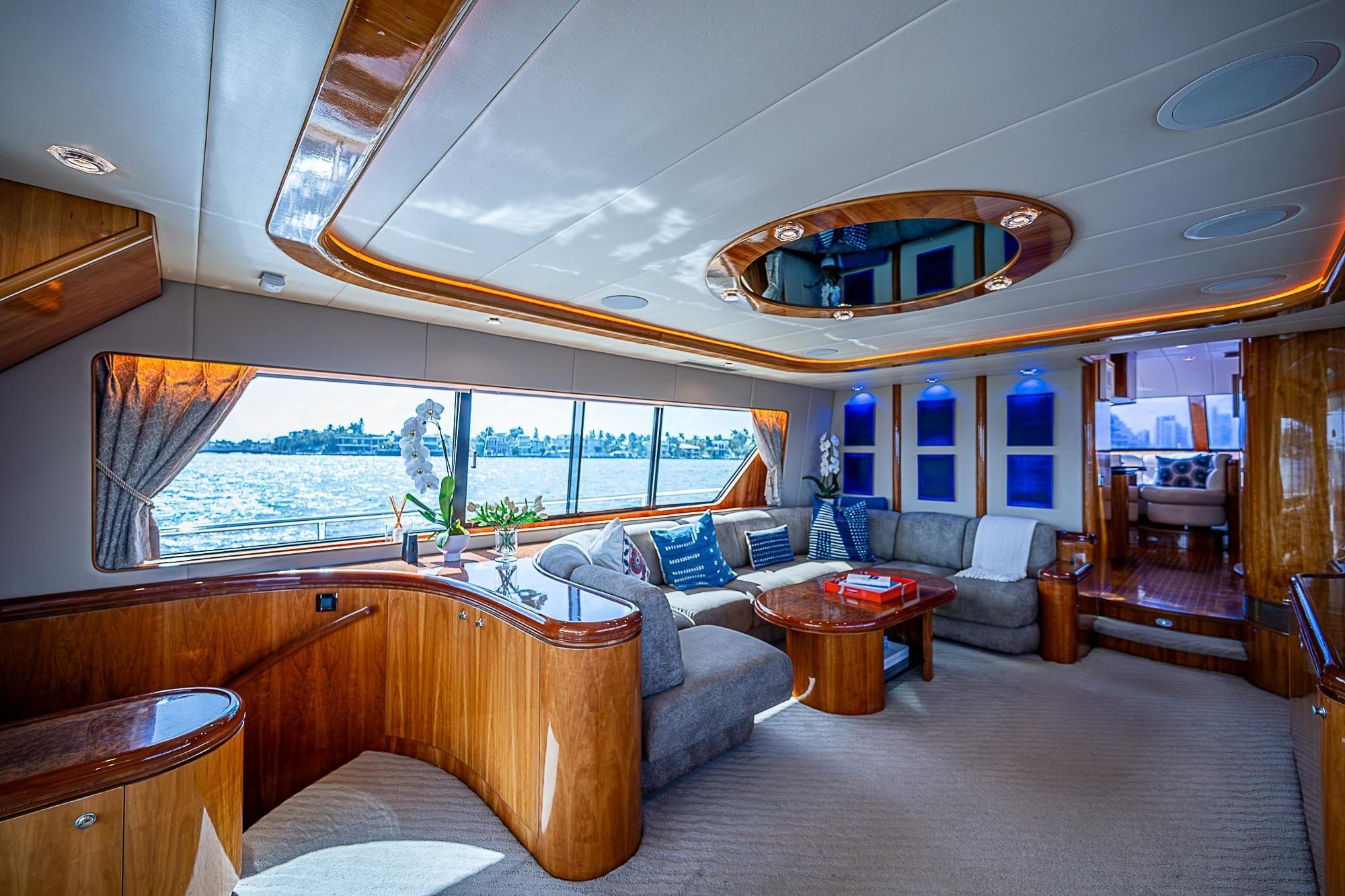 Luxurious interior of 2000 Horizon 82 yacht with elegant seating and panoramic windows.