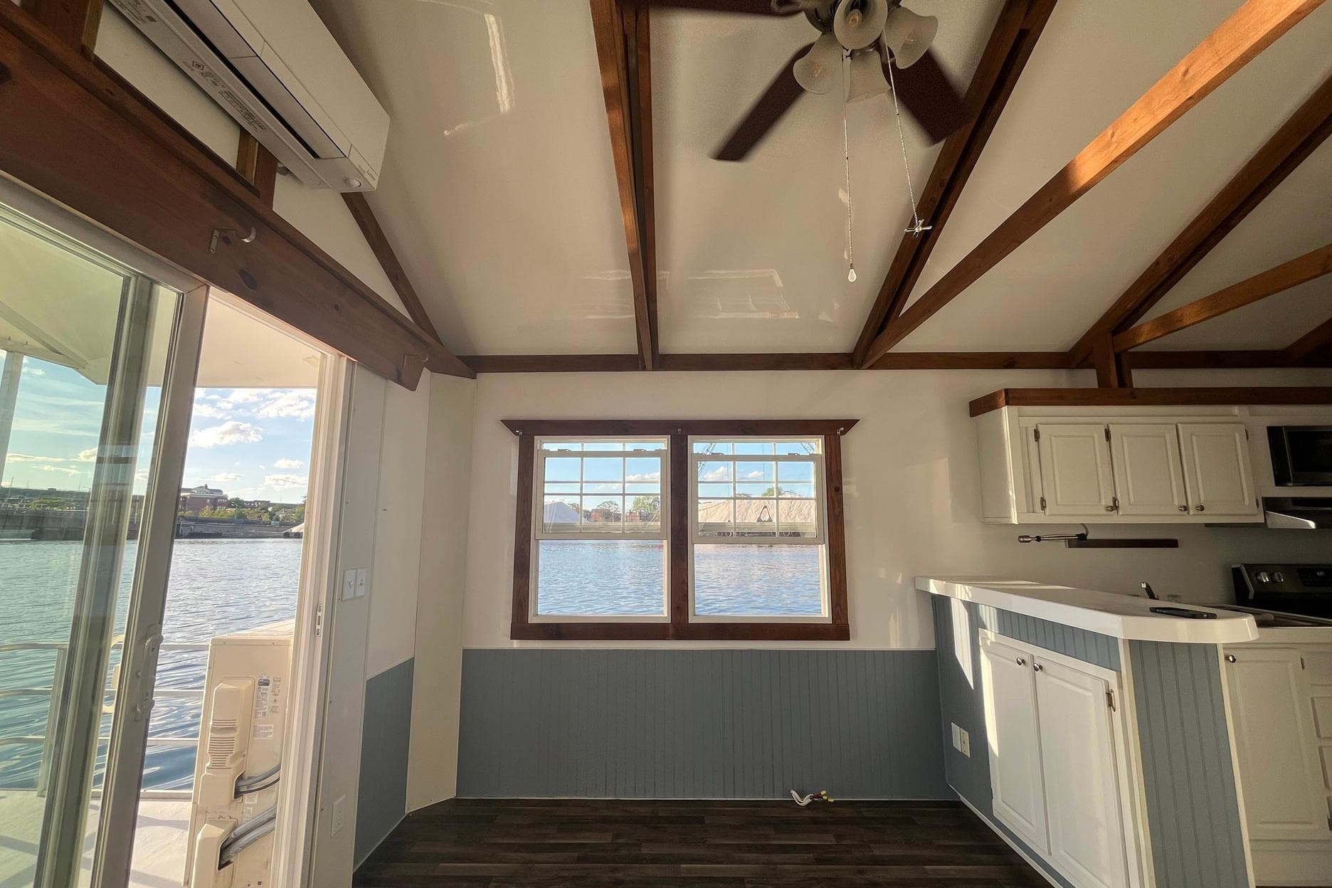 Interior of 2017 Catamaran Cruisers Aqualodge with waterfront view and modern kitchen.
