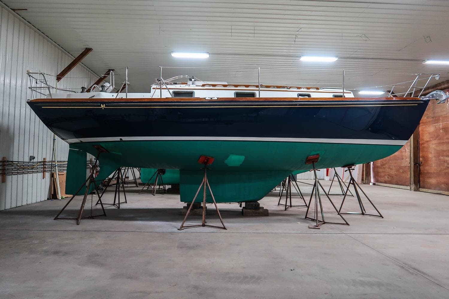 1989 Morris Ocean Series 32 sailboat in indoor storage on stands.