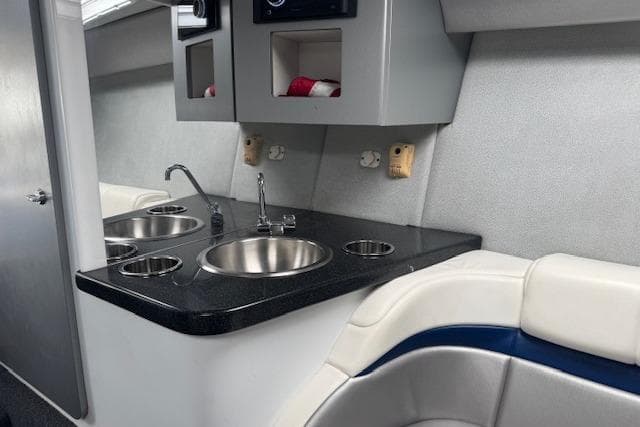 2007 Formula 353 FASTech boat interior with kitchenette and seating area.