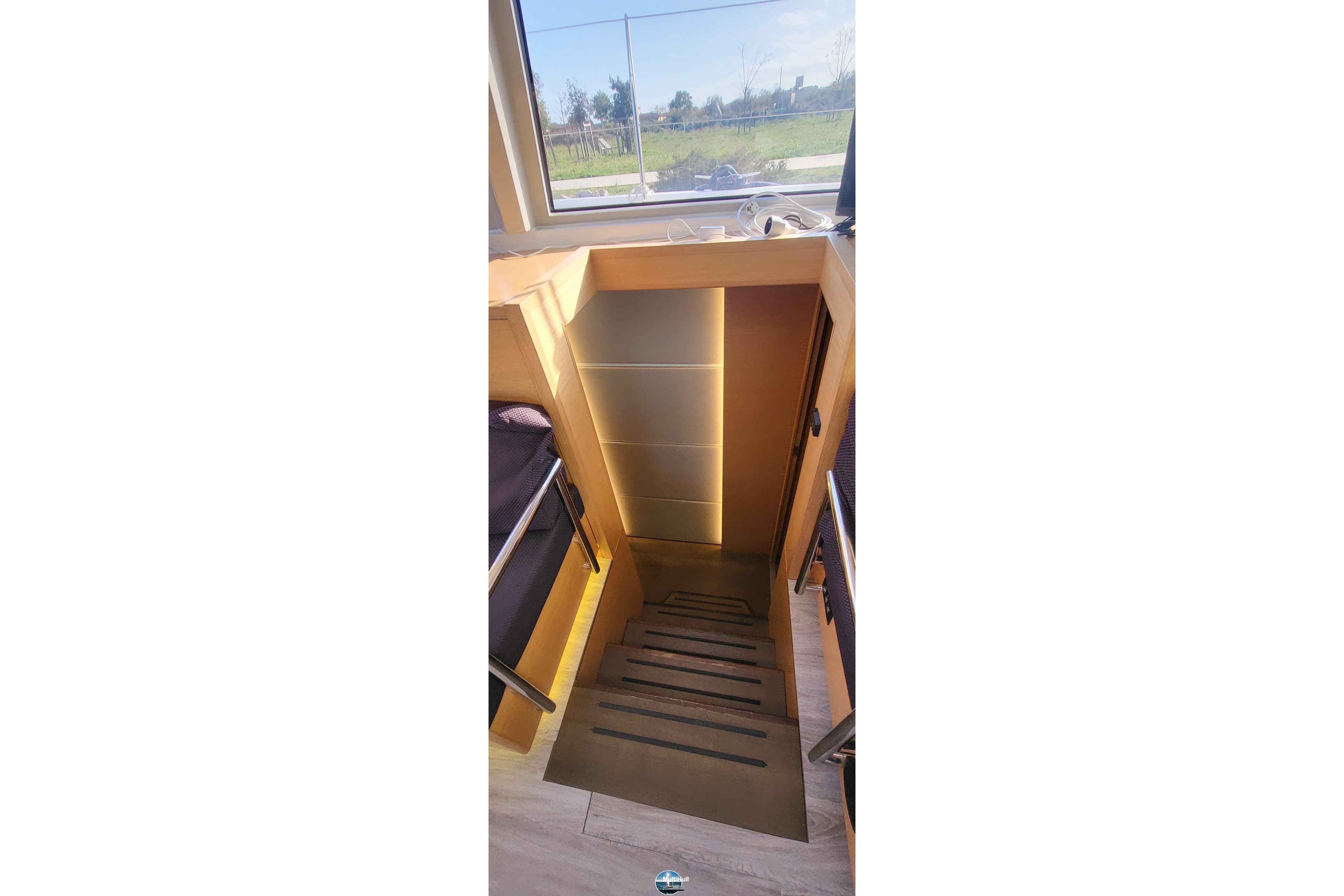 Staircase inside 2018 Nautitech 46 Open catamaran, featuring modern design and natural lighting.