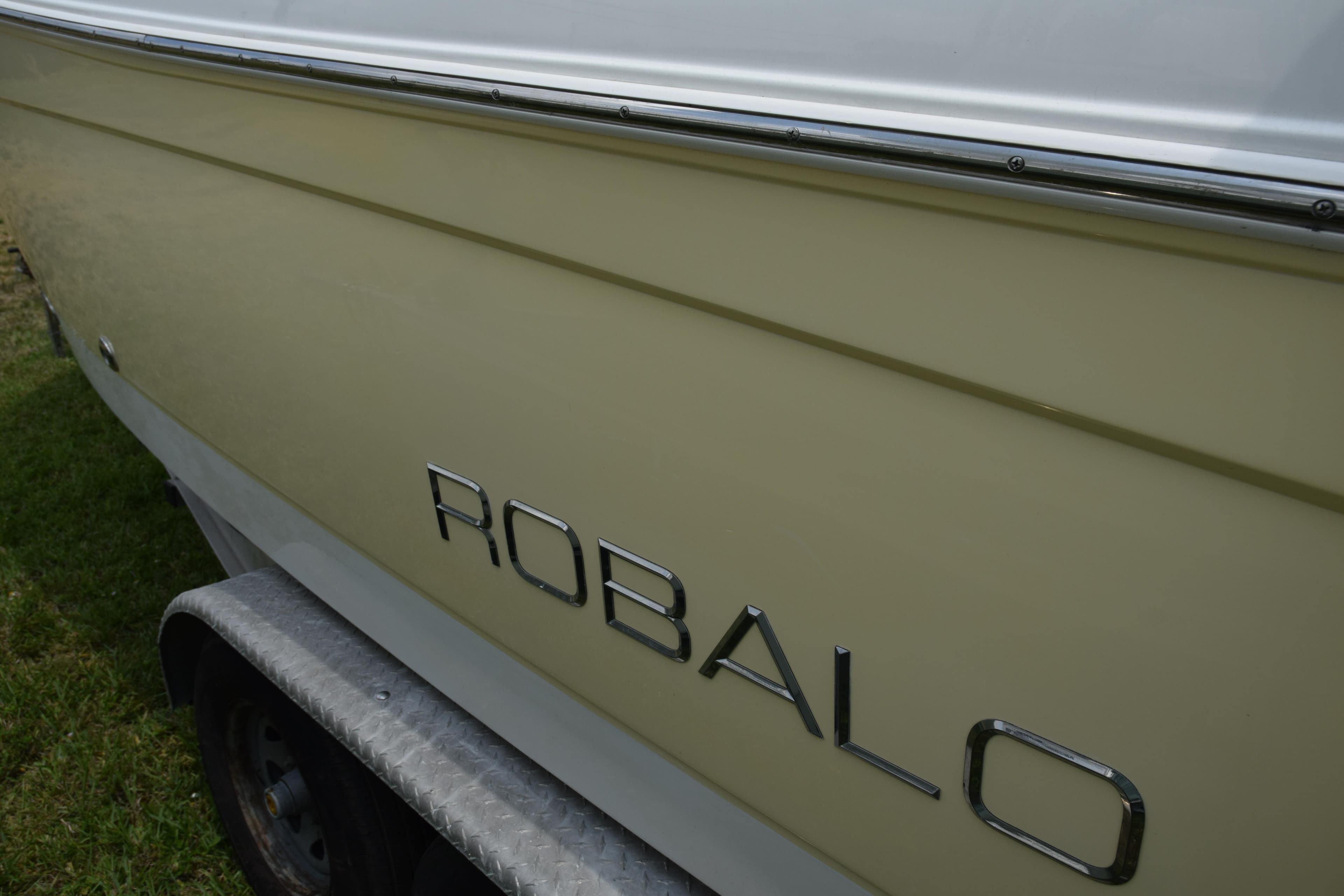 2006 Robalo R260 Center Console boat side view with logo.