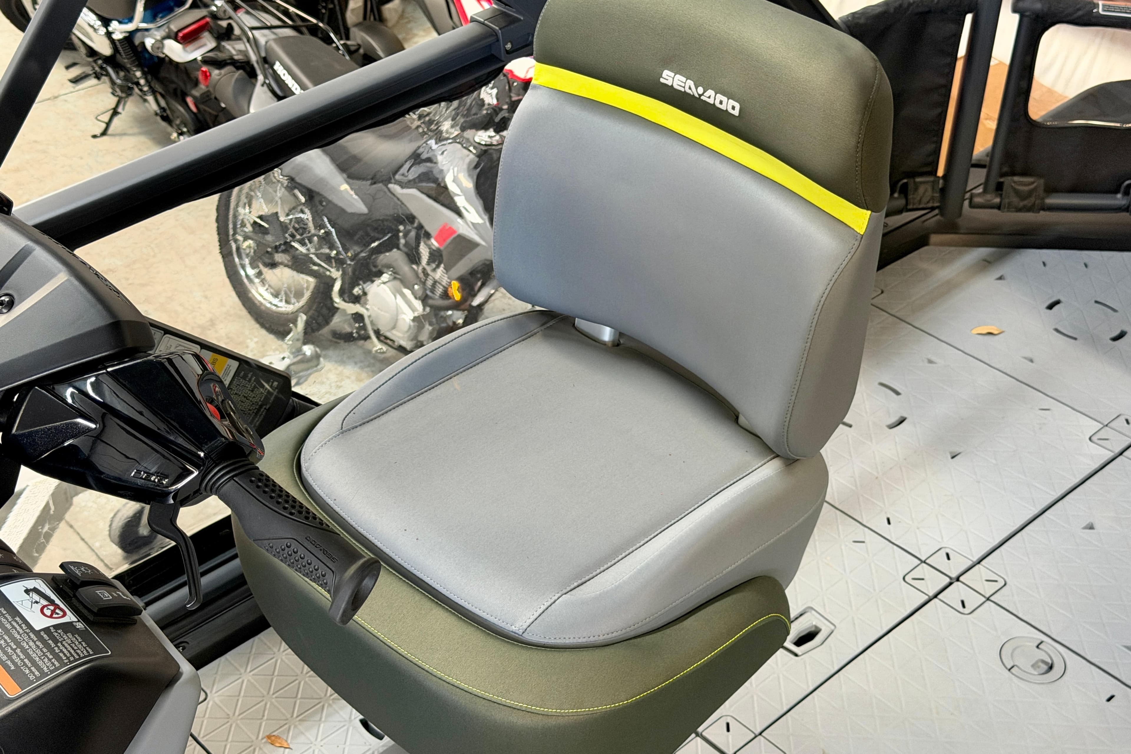 2026 Sea-Doo Switch Fish 21 seat with steering controls, showcasing modern design.