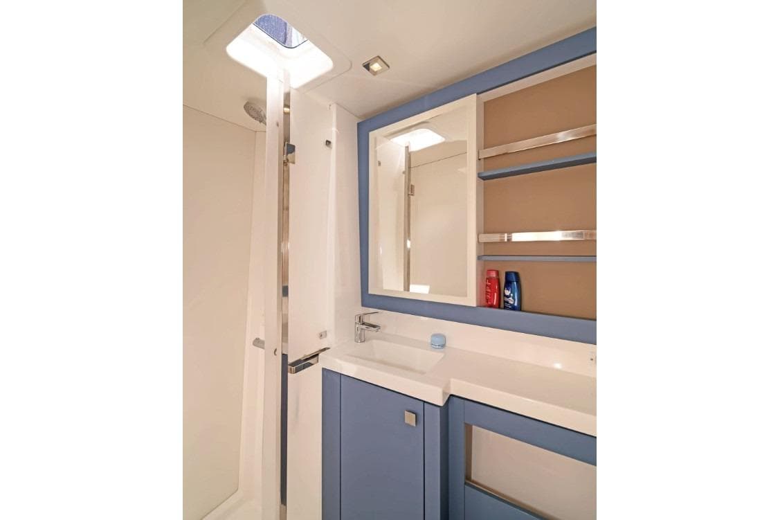 Modern bathroom interior of 2025 Fountaine Pajot Tanna 47 yacht, featuring sleek design.