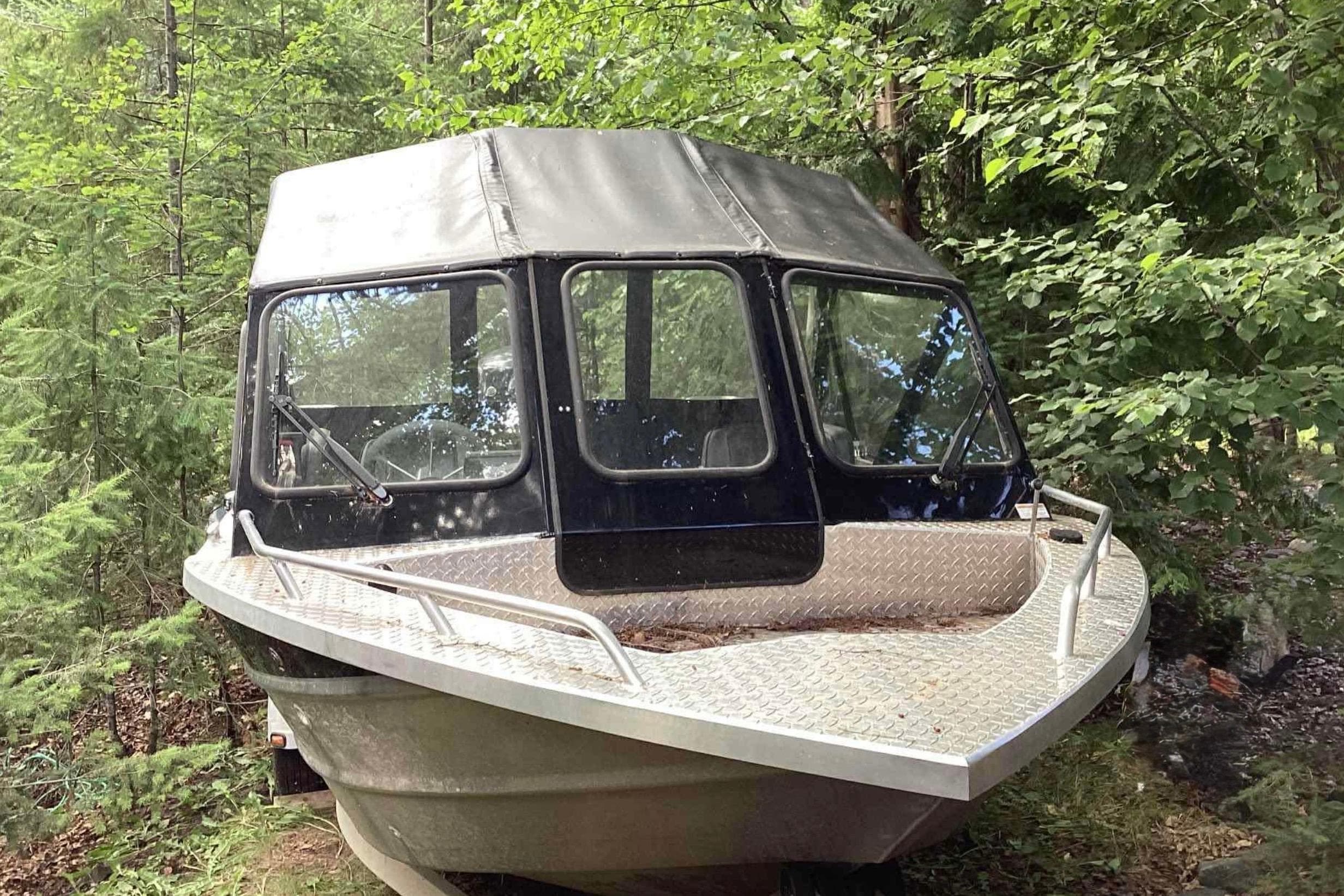 2018 Thunder Jet 185 Explorer boat in a wooded area.