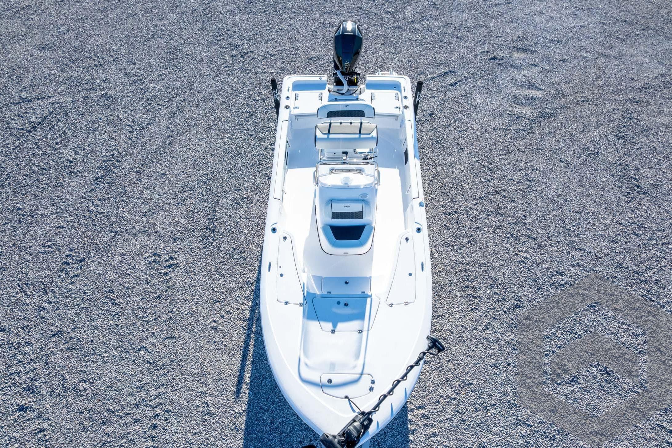 2026 Tidewater 2110 Bay Max boat on gravel surface, aerial view.
