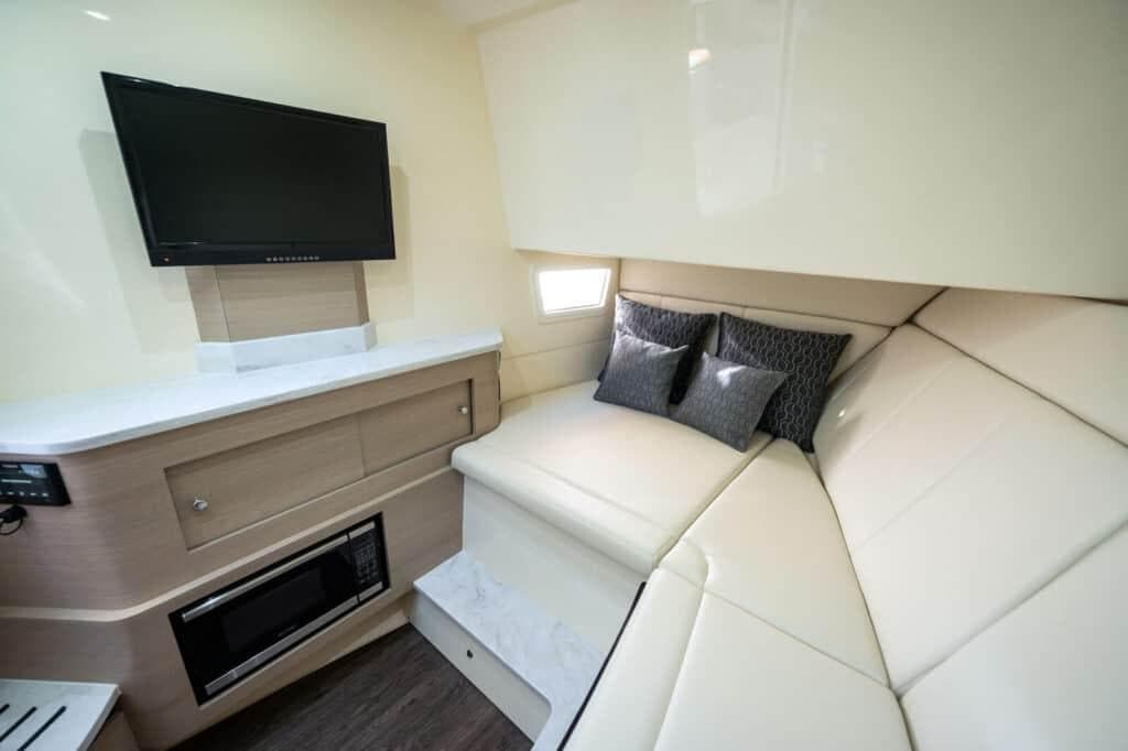 Manufacturer Provided Image: 2022 Scout 350 LXZ cabin interior with TV, microwave, and cozy seating.