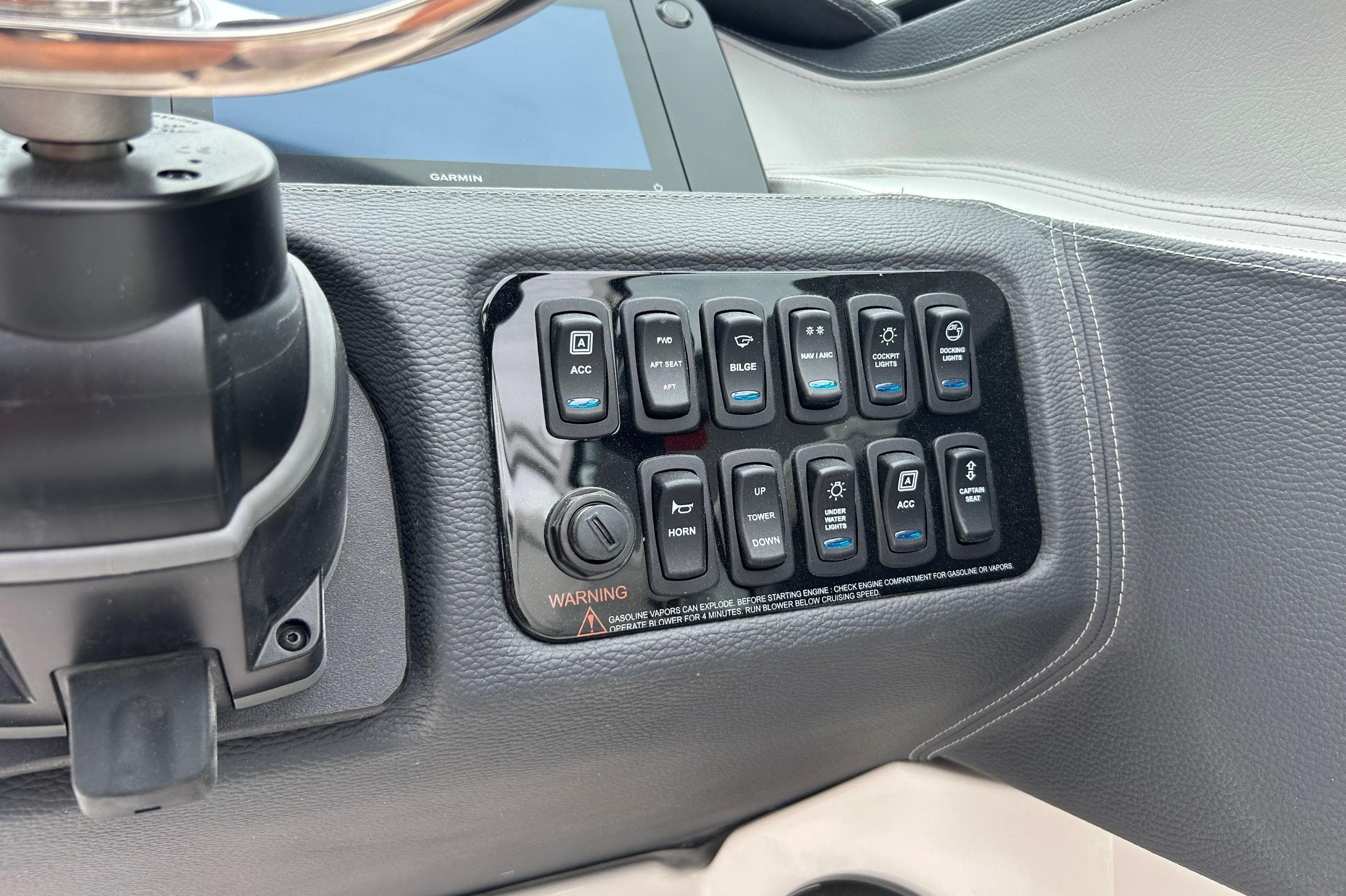Control panel of 2022 Regal LX4 boat with various switches and buttons.