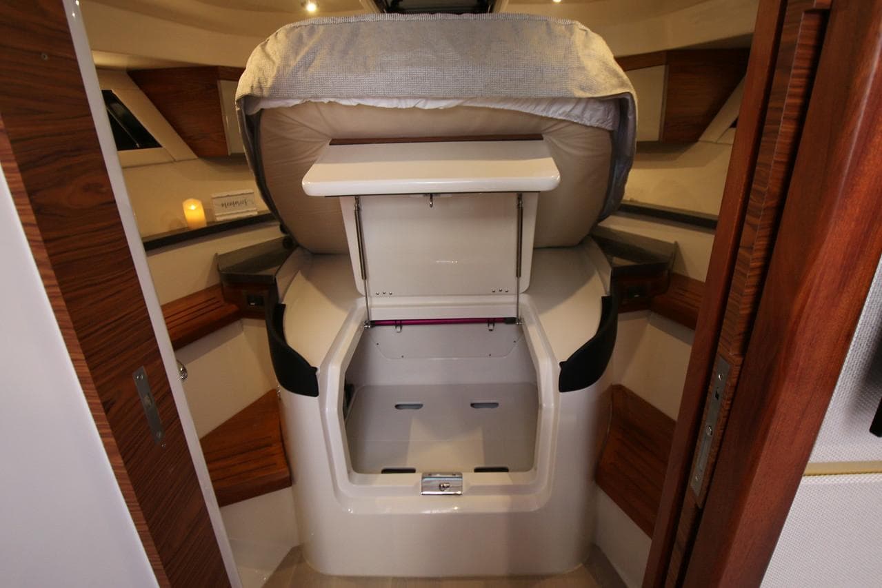 Manufacturer Provided Image: 2026 Boston Whaler 405 Conquest cabin interior with storage and seating.
