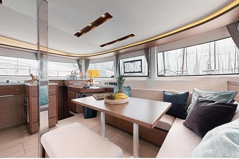Interior of 2020 Lagoon 46 catamaran with modern kitchen and dining area.
