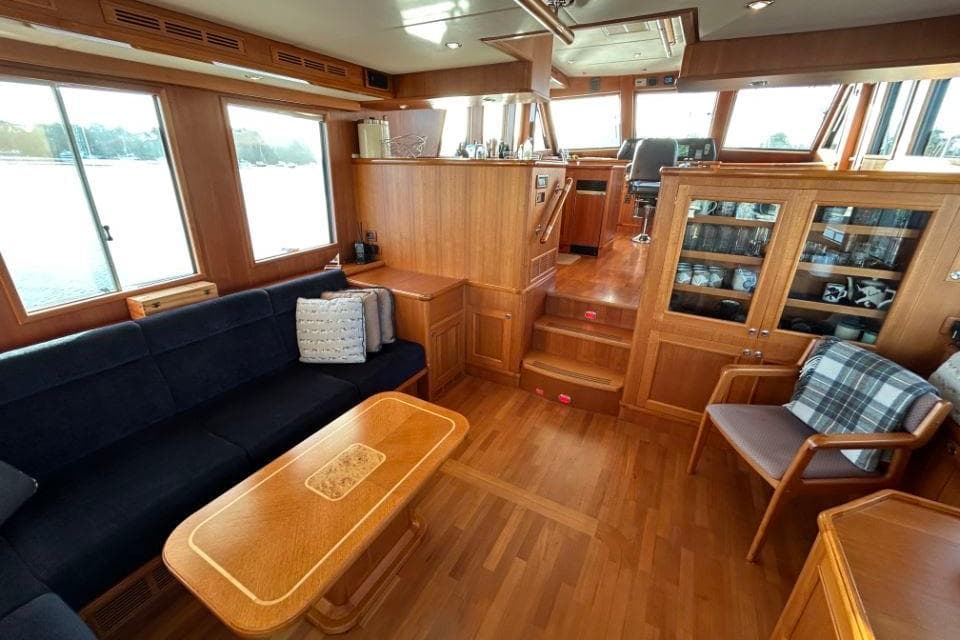 Luxurious interior of 2008 Grand Banks 59 Aleutian RP yacht with wooden furnishings.
